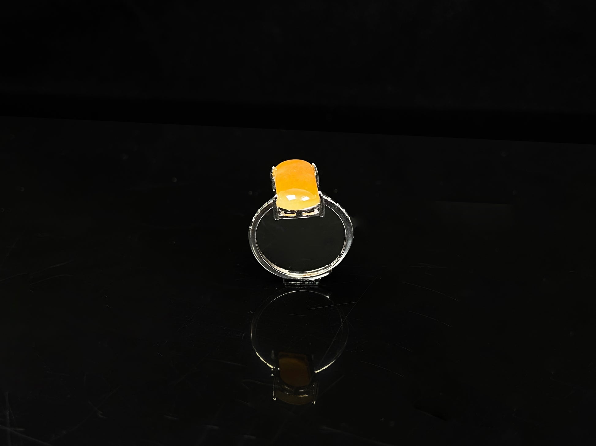 A butterscotch glow saddle jadeite ring.