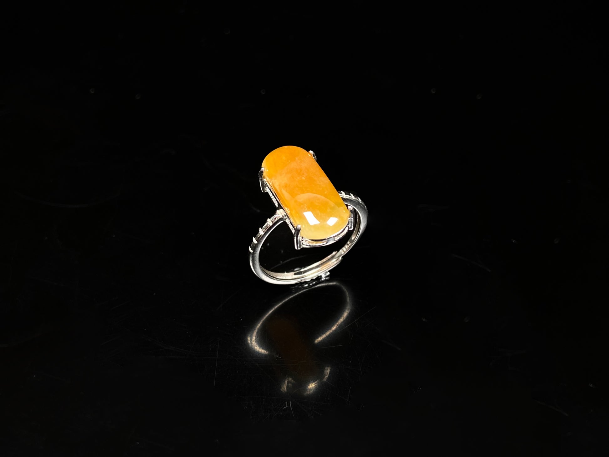 A butterscotch glow saddle jadeite ring.