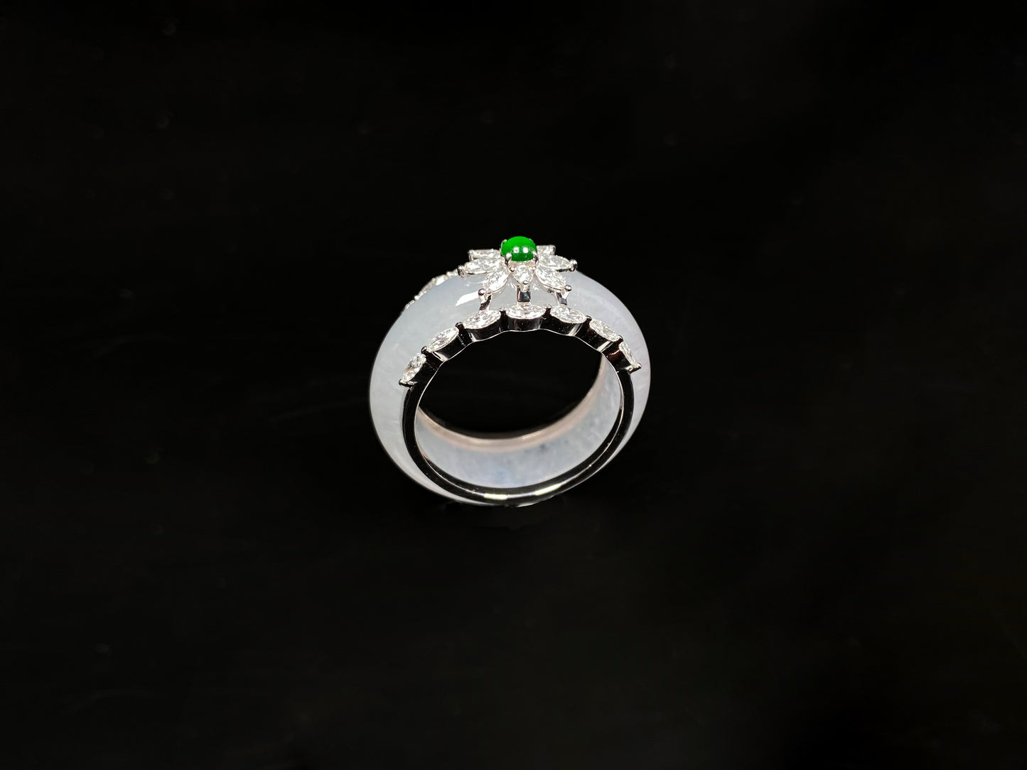 A icy white with green accent jadeite ring.