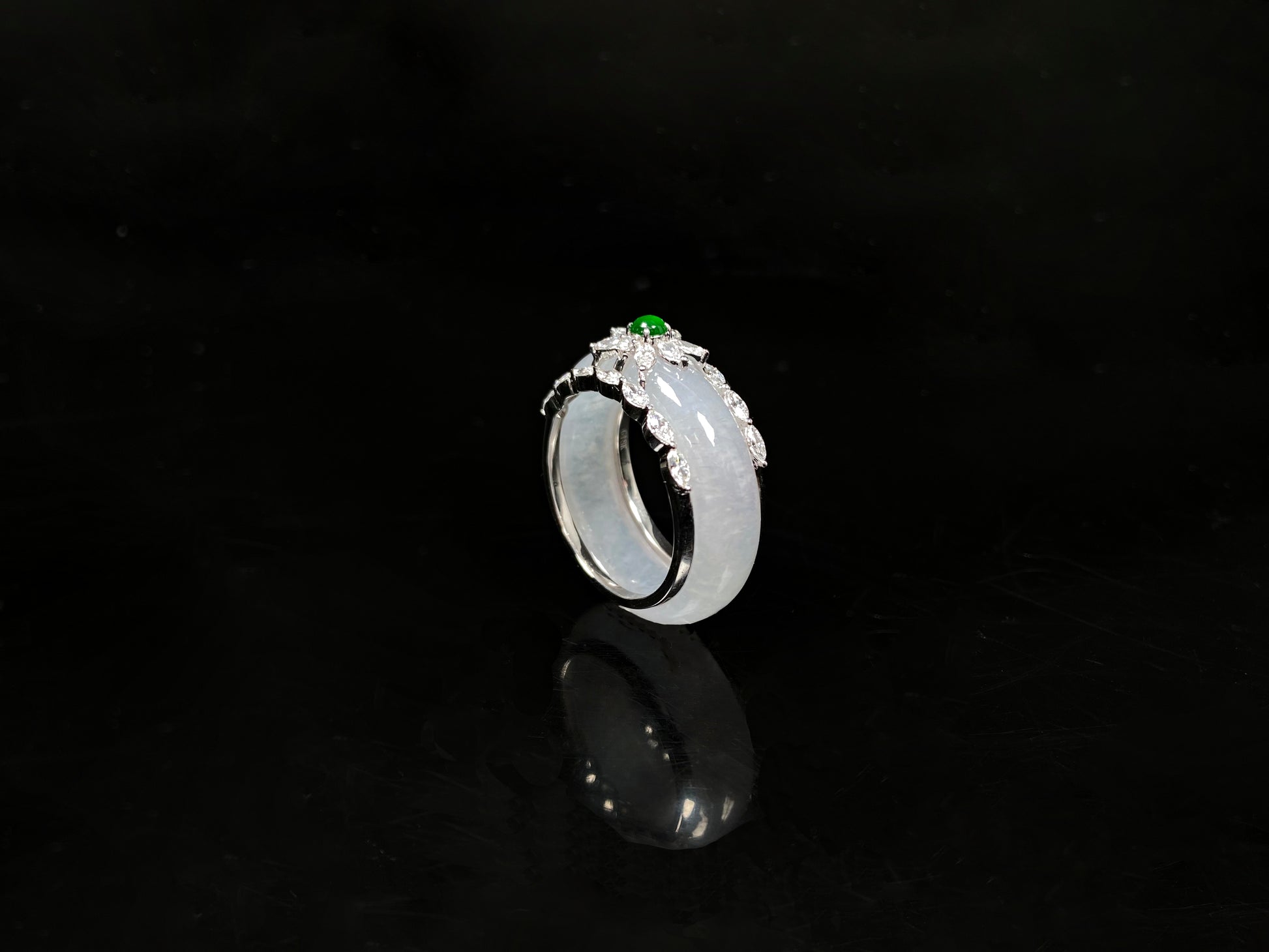 A icy white with green accent jadeite ring.