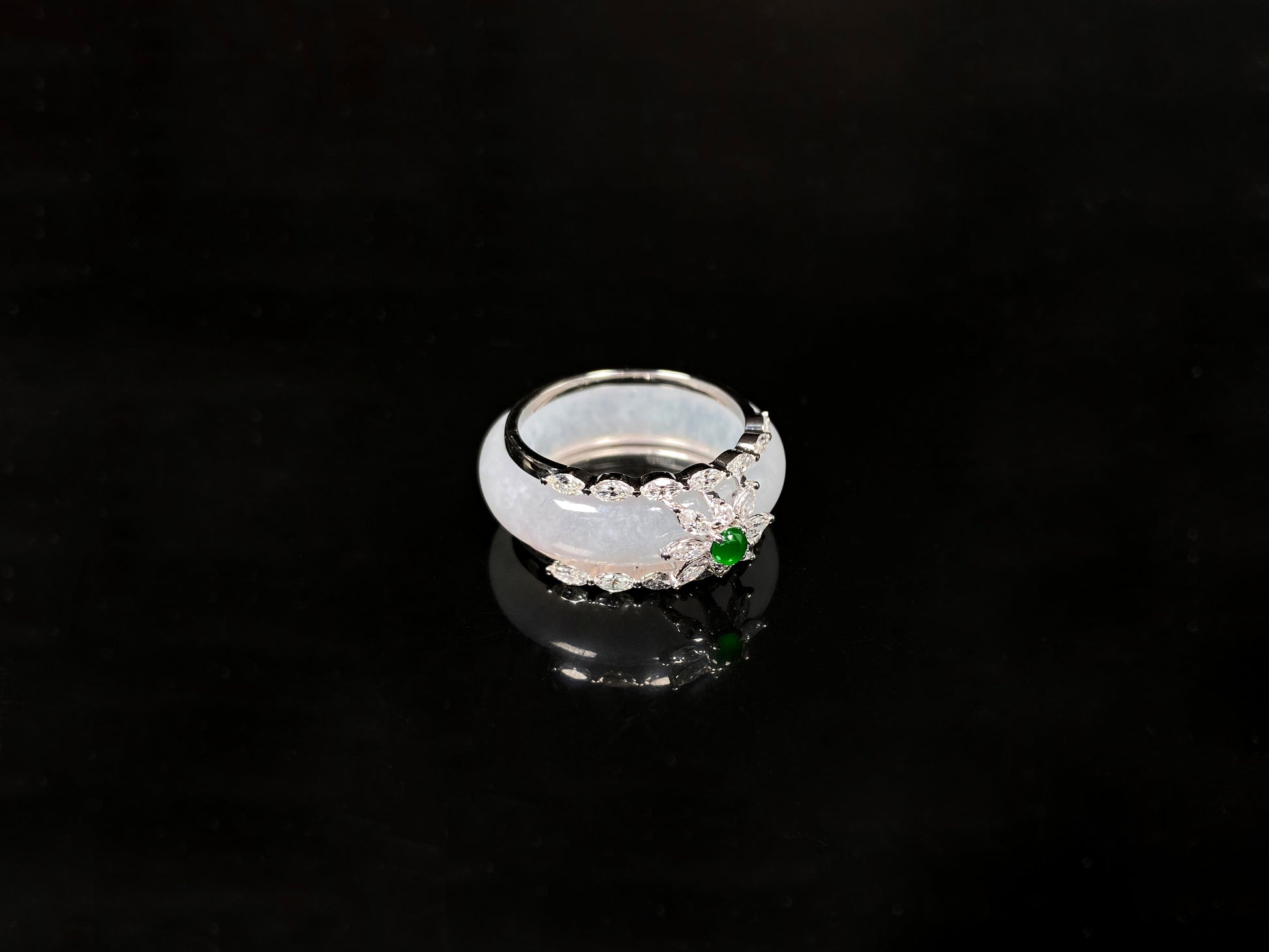 A icy white with green accent jadeite ring.