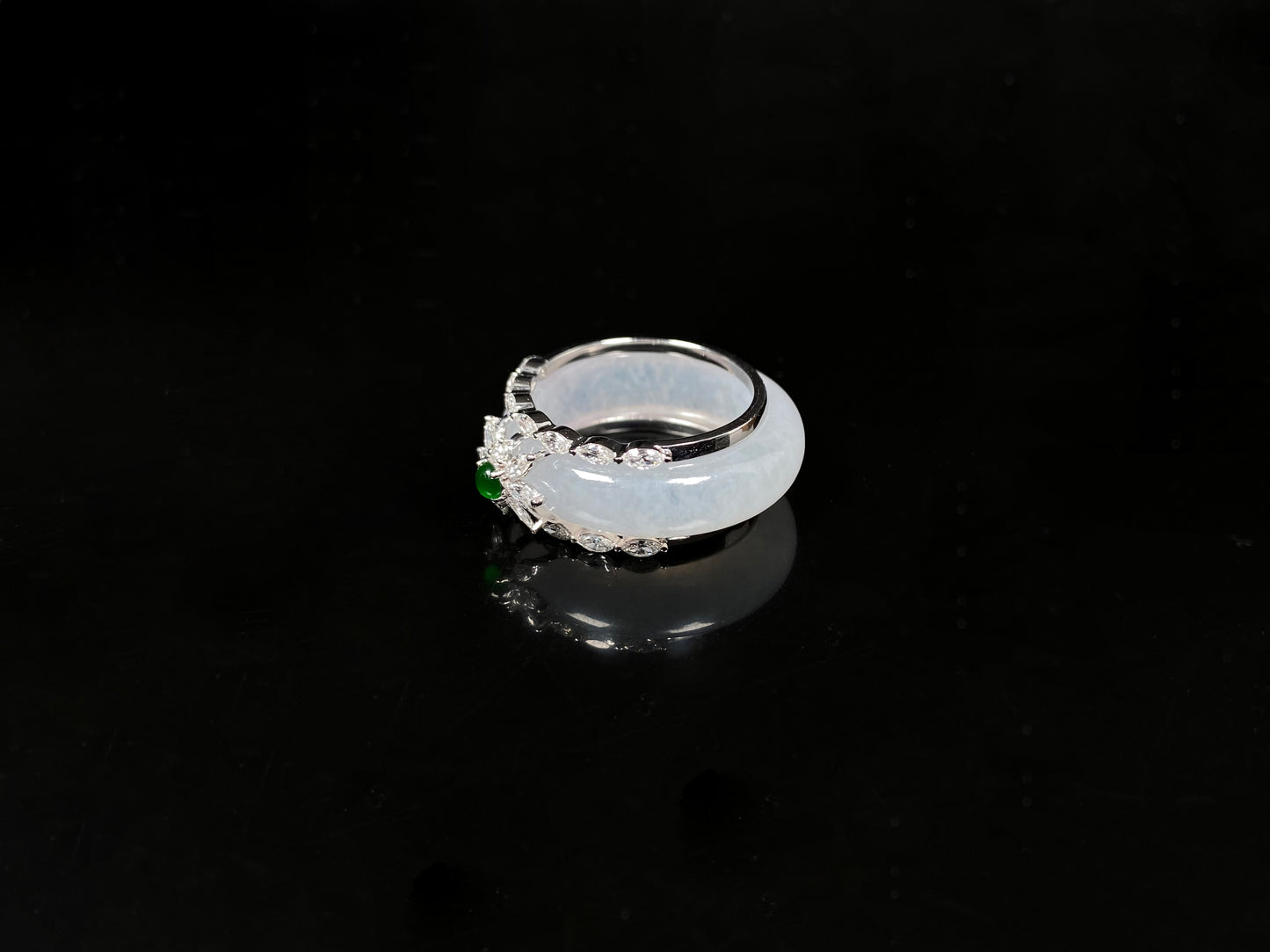 A icy white with green accent jadeite ring.