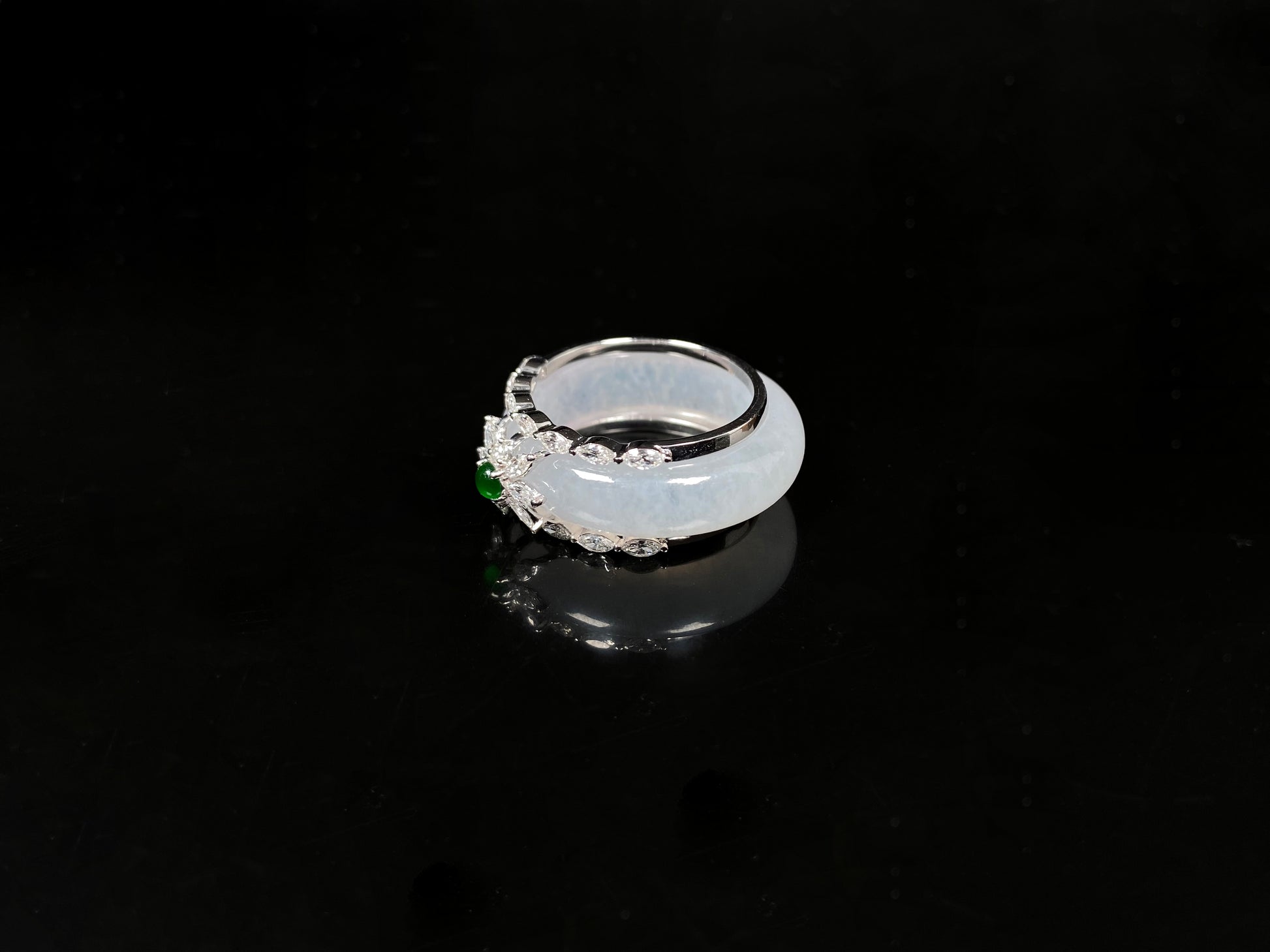A icy white with green accent jadeite ring.