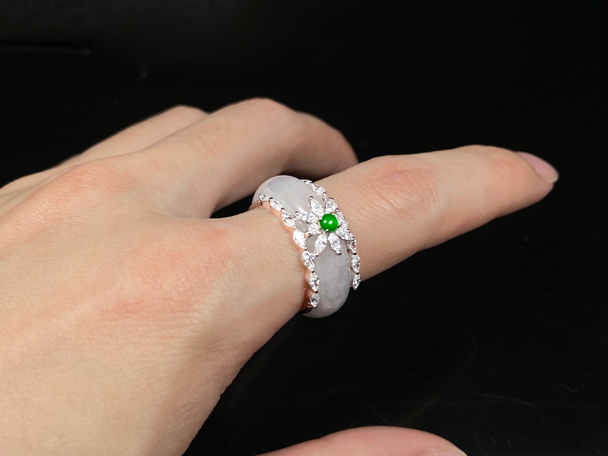 A icy white with green accent jadeite ring.