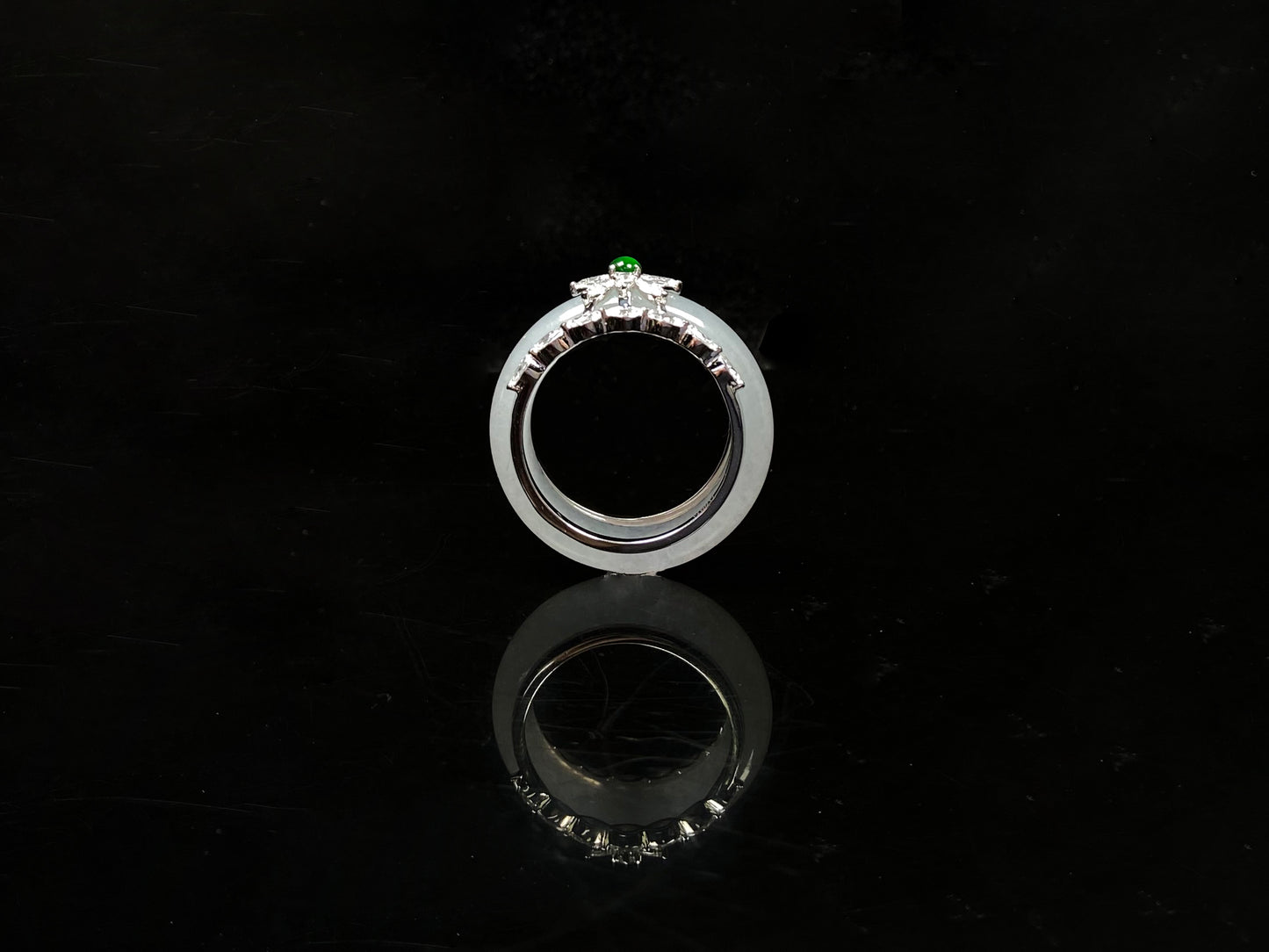 A icy white with green accent jadeite ring.