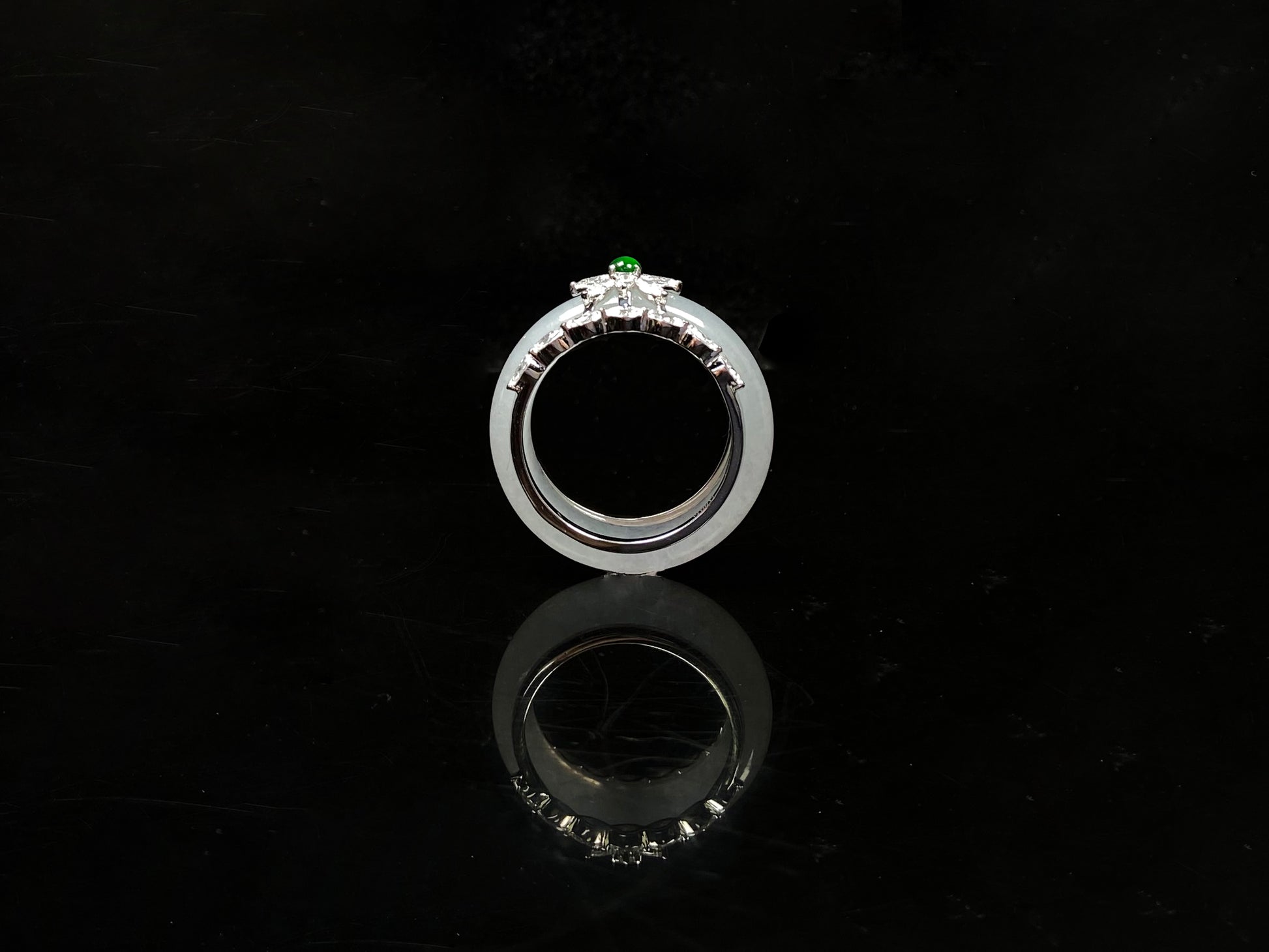 A icy white with green accent jadeite ring.