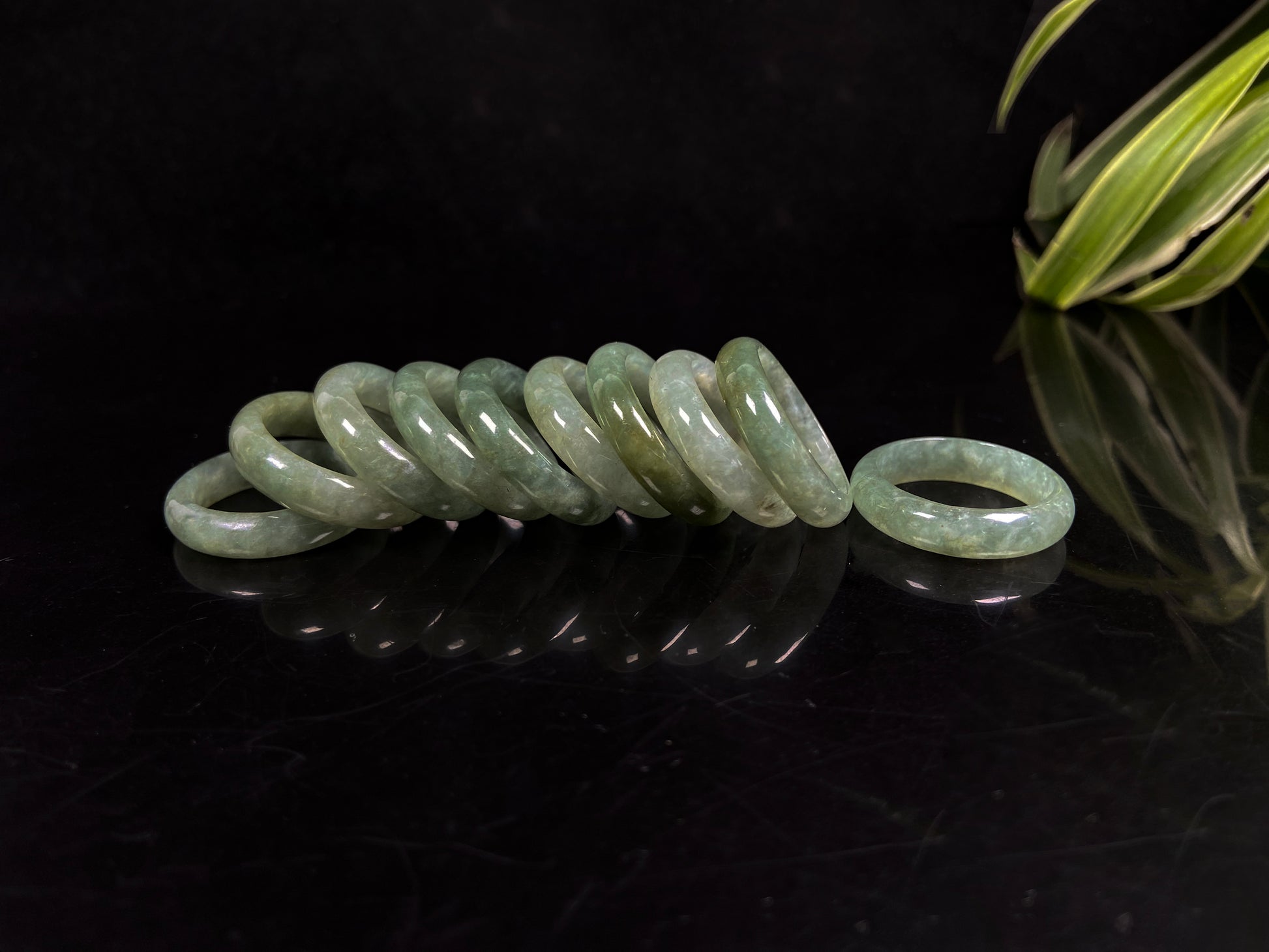 A muted green serenity jadeite ring group.