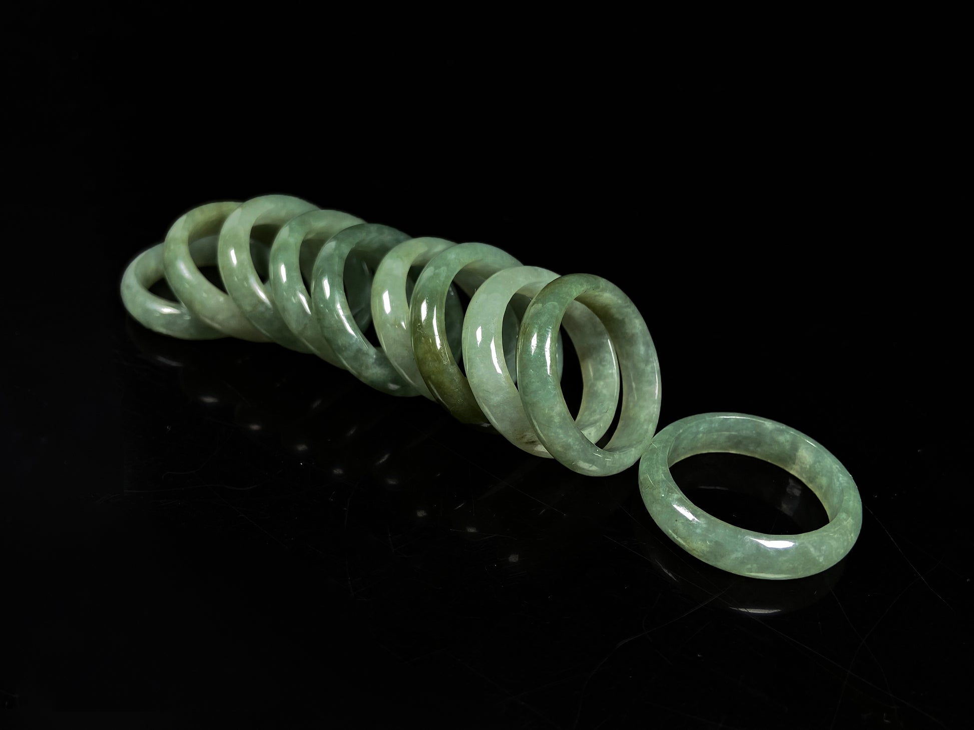 A muted green serenity jadeite ring group.