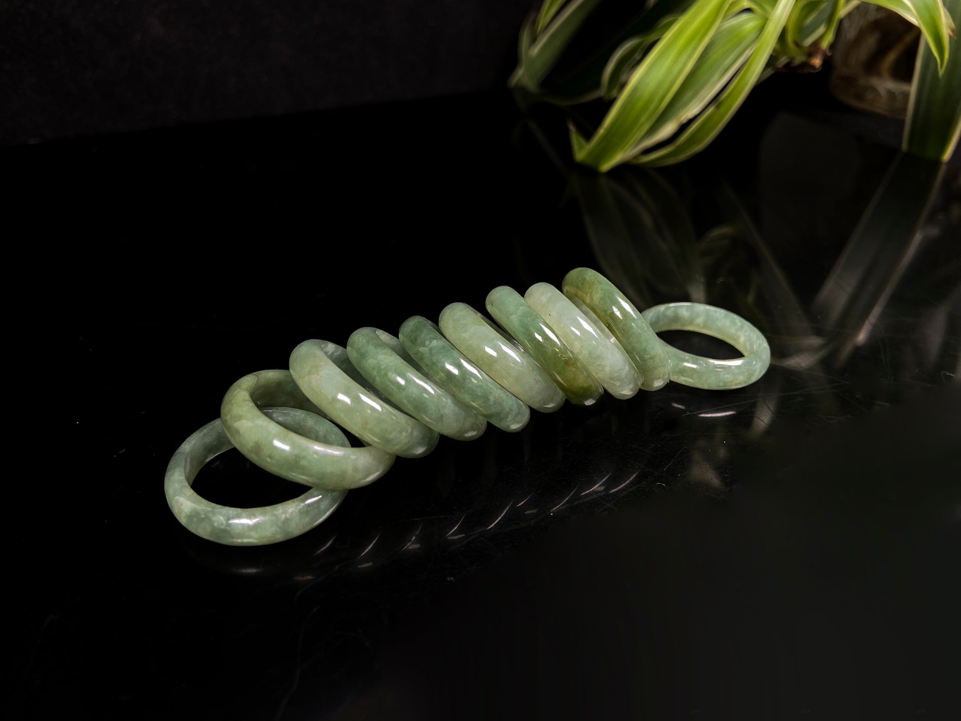 A muted green serenity jadeite ring group.