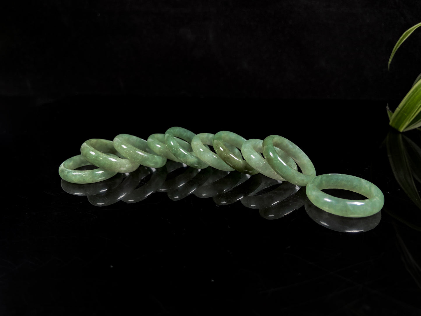 A muted green serenity jadeite ring group.