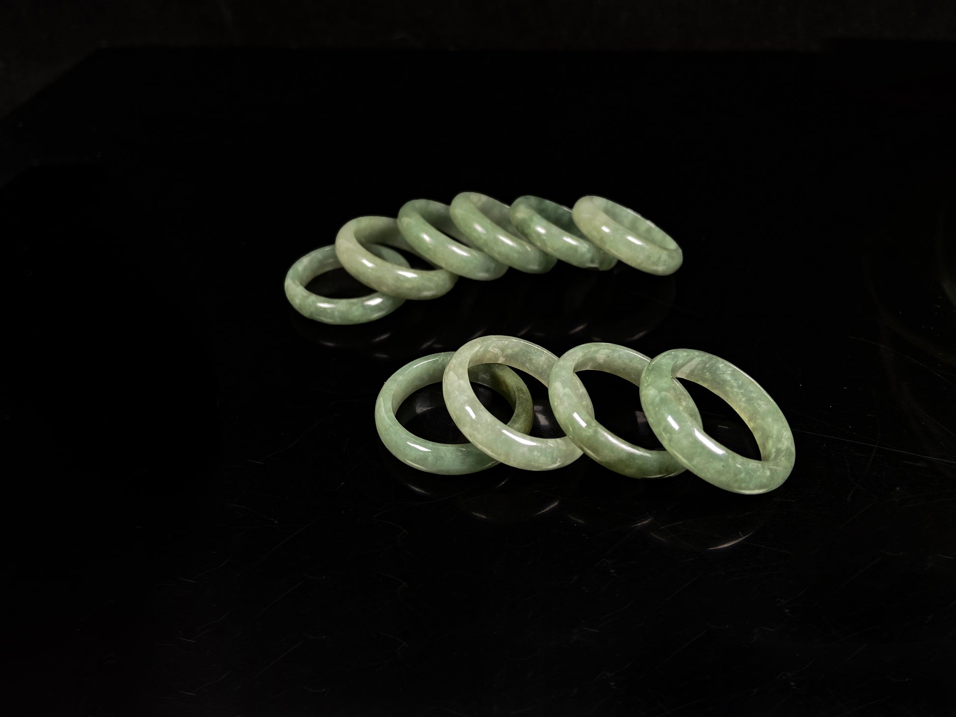 A muted green serenity jadeite ring group.