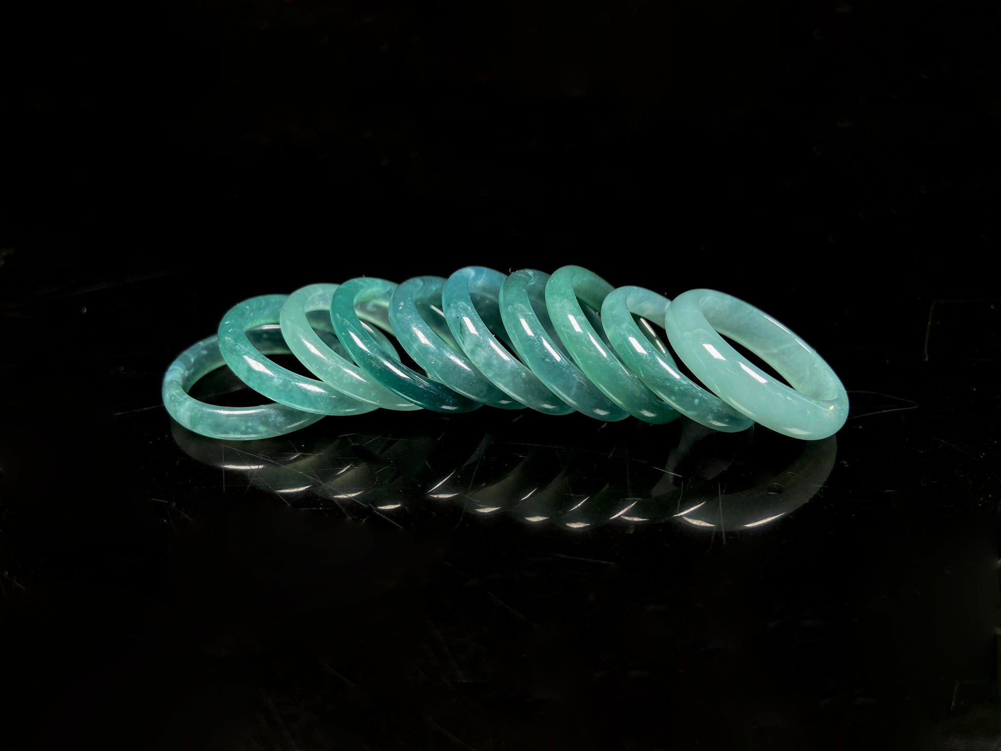 A glacial teal dew calm jadeite ring.