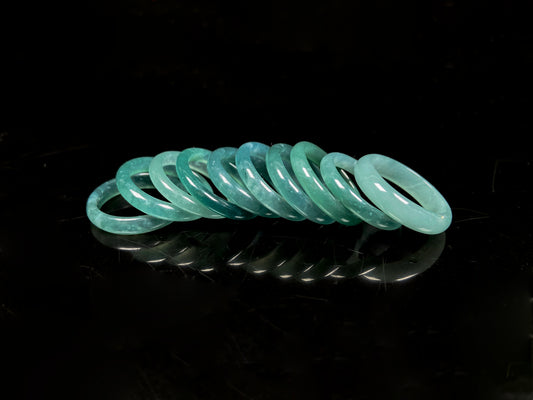 A glacial teal dew calm jadeite ring.