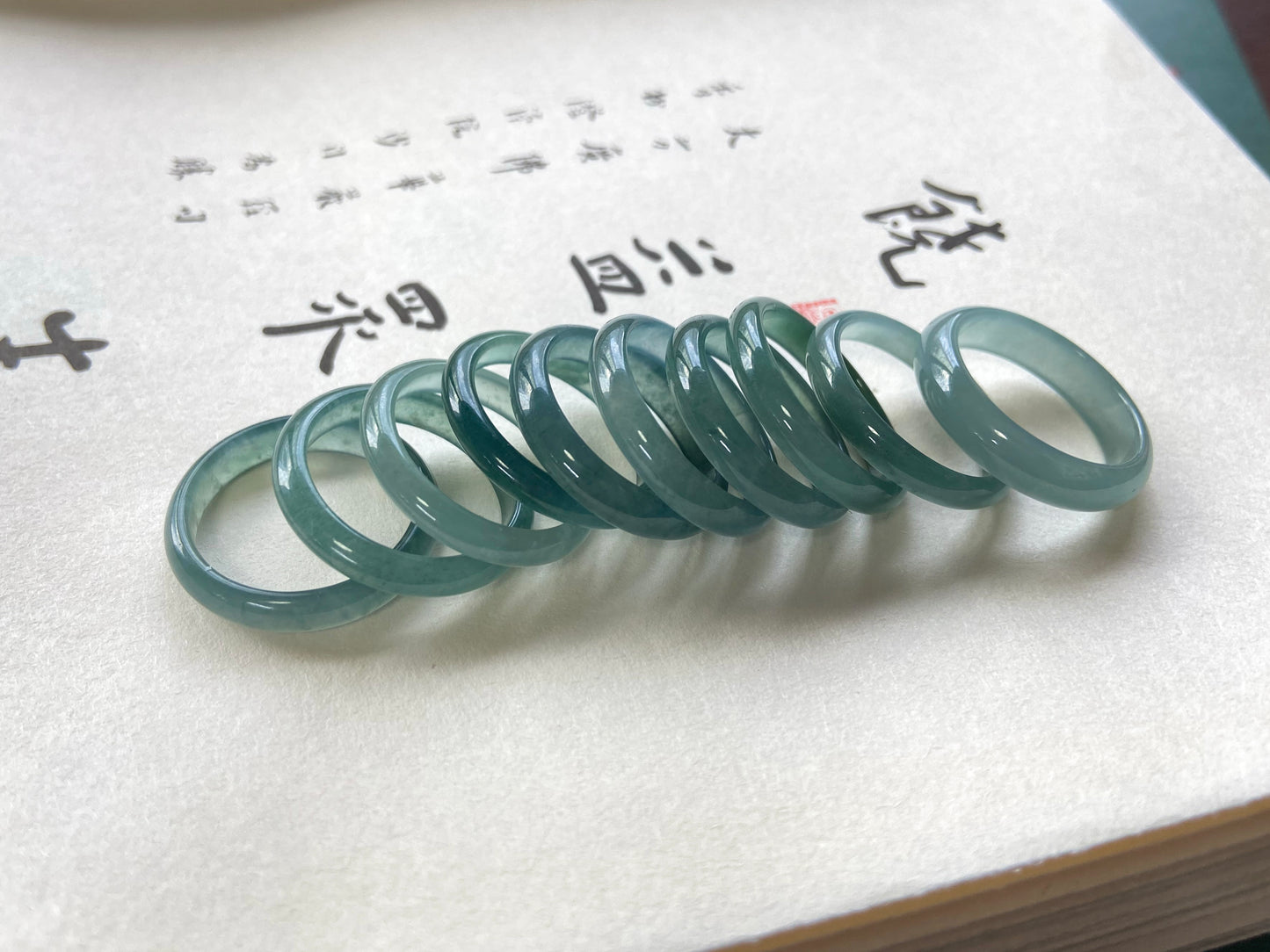 A glacial teal dew calm jadeite ring.