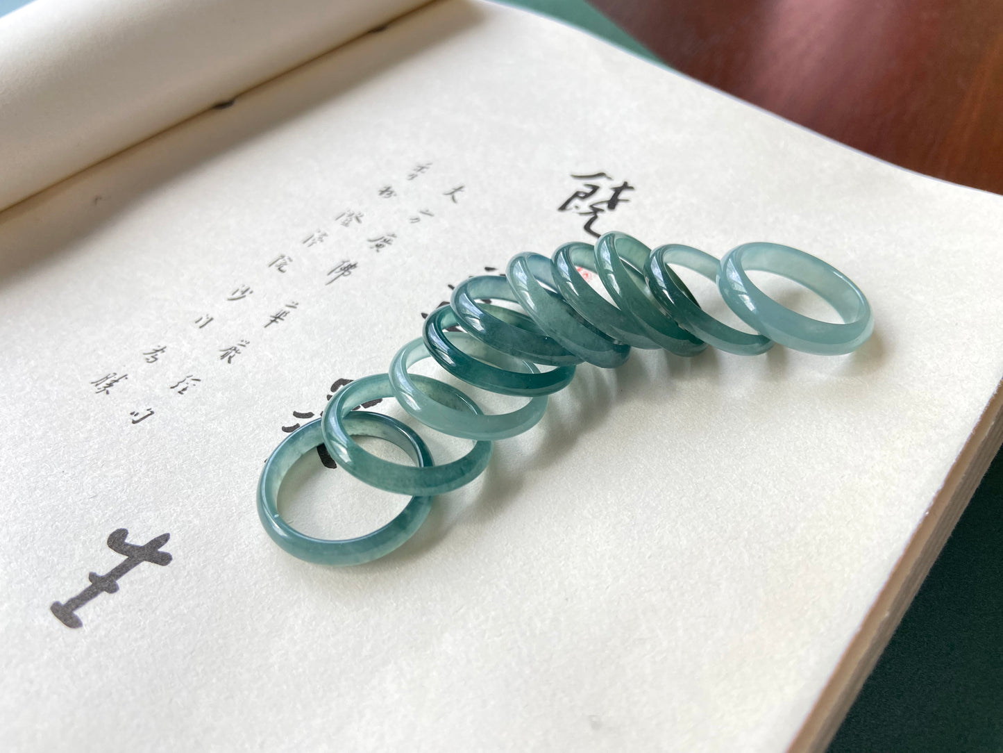 A glacial teal dew calm jadeite ring.