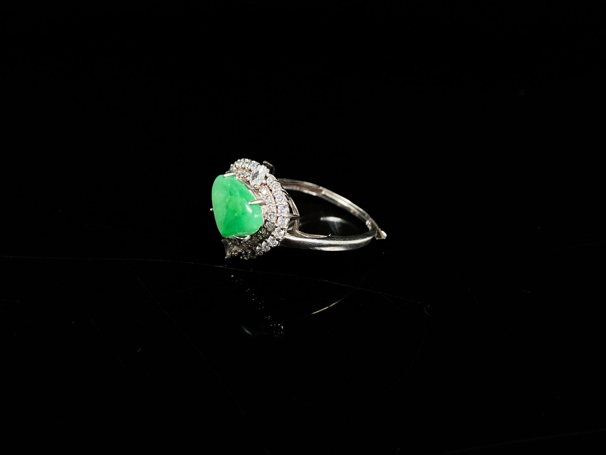 A apple green heart jadeite ring.