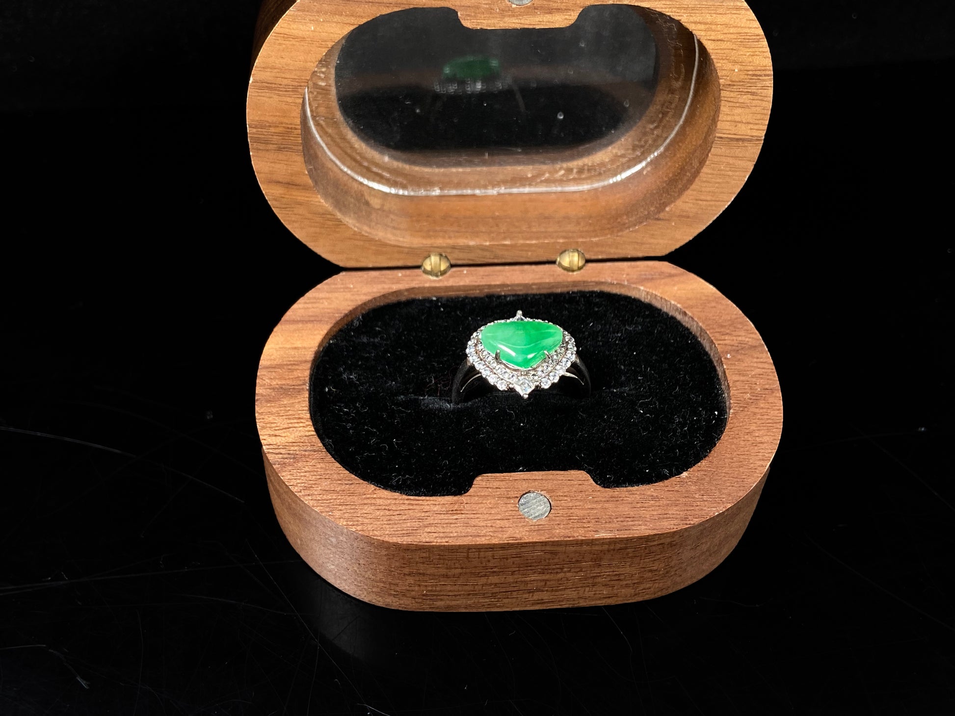 A apple green heart jadeite ring.