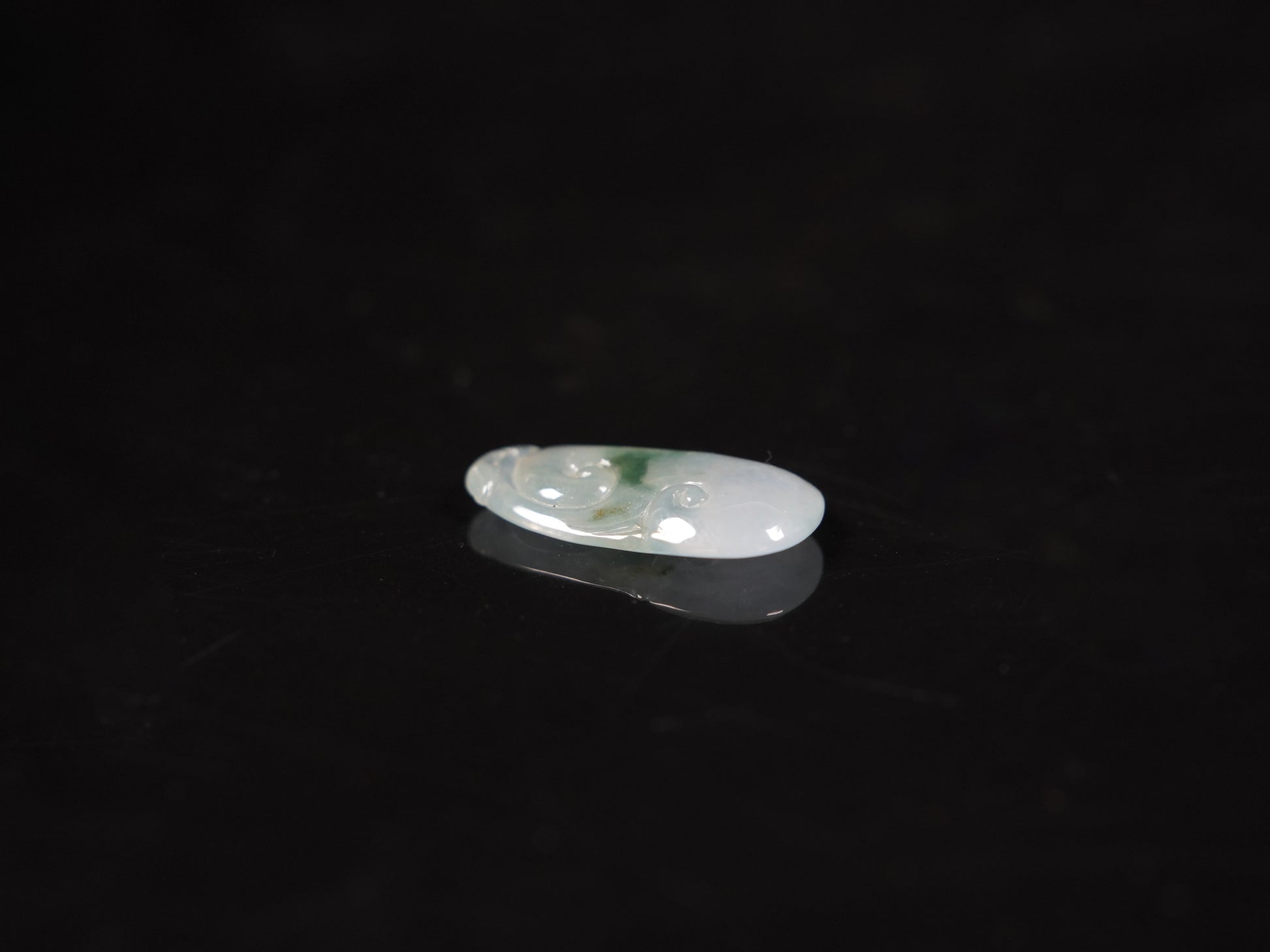 A icy translucent moss infused Ruyi loose jadeite.