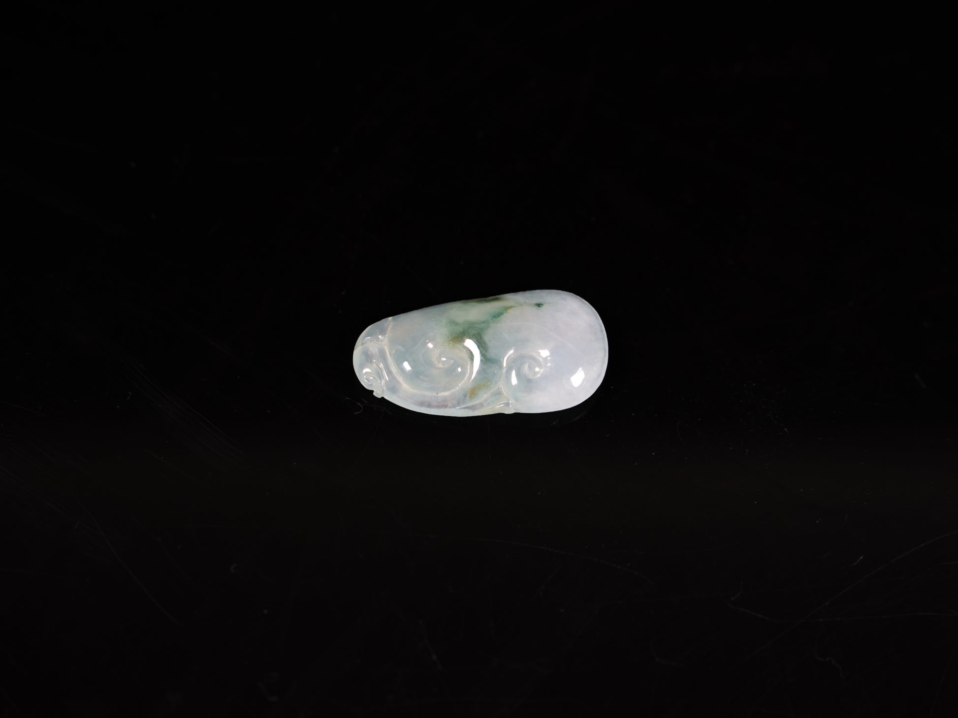 A icy translucent moss infused Ruyi loose jadeite.