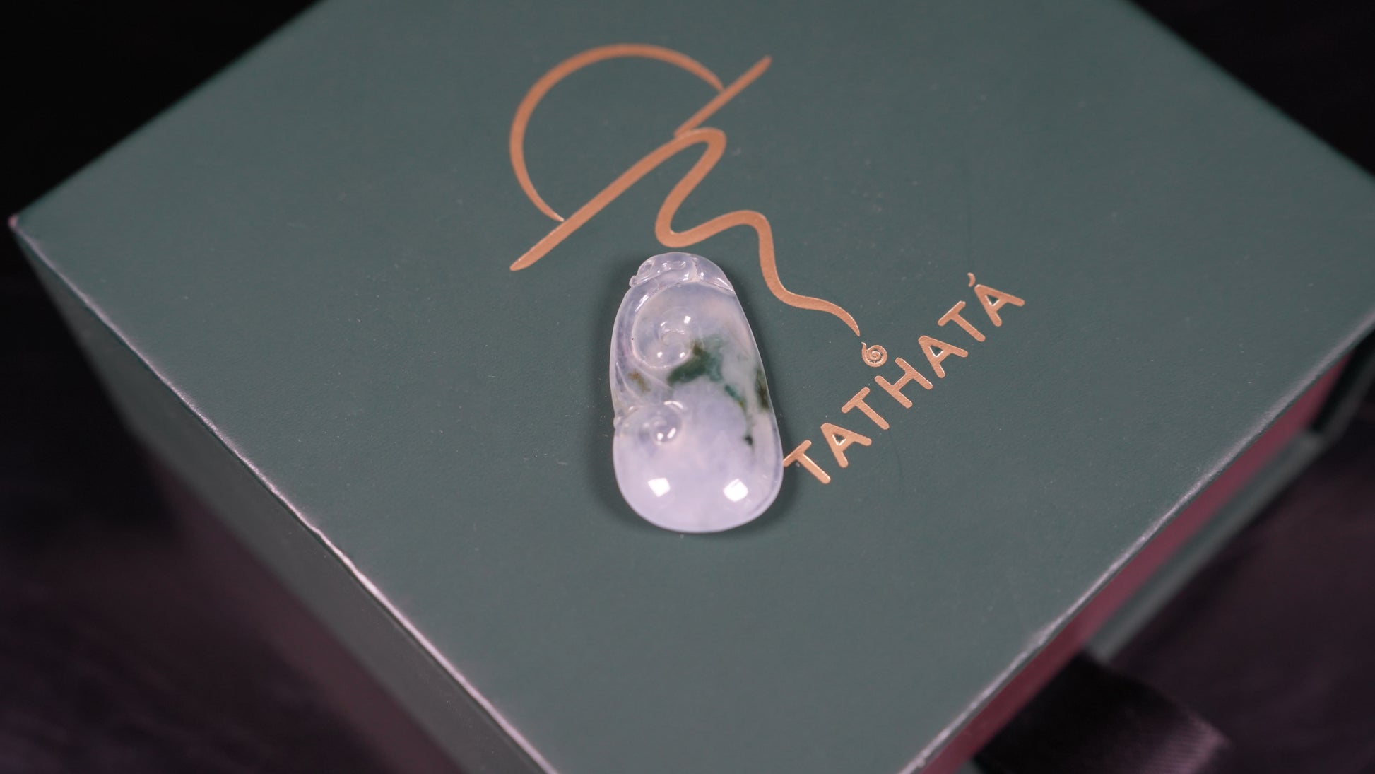 A icy translucent moss infused Ruyi loose jadeite.