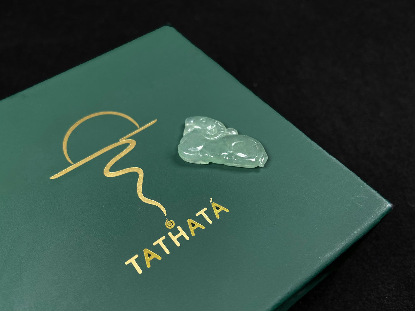 A lustrous pale green sheep loose jadeite.