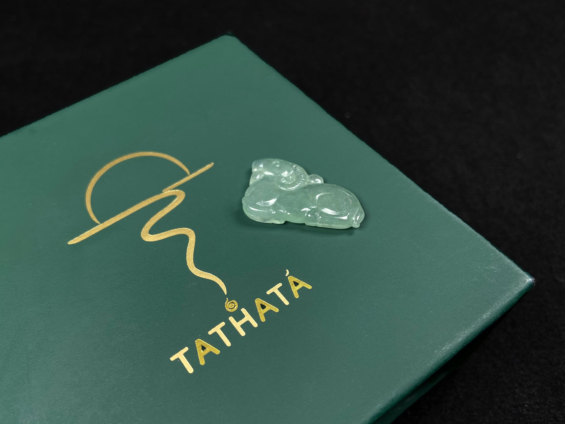 A lustrous pale green sheep loose jadeite.