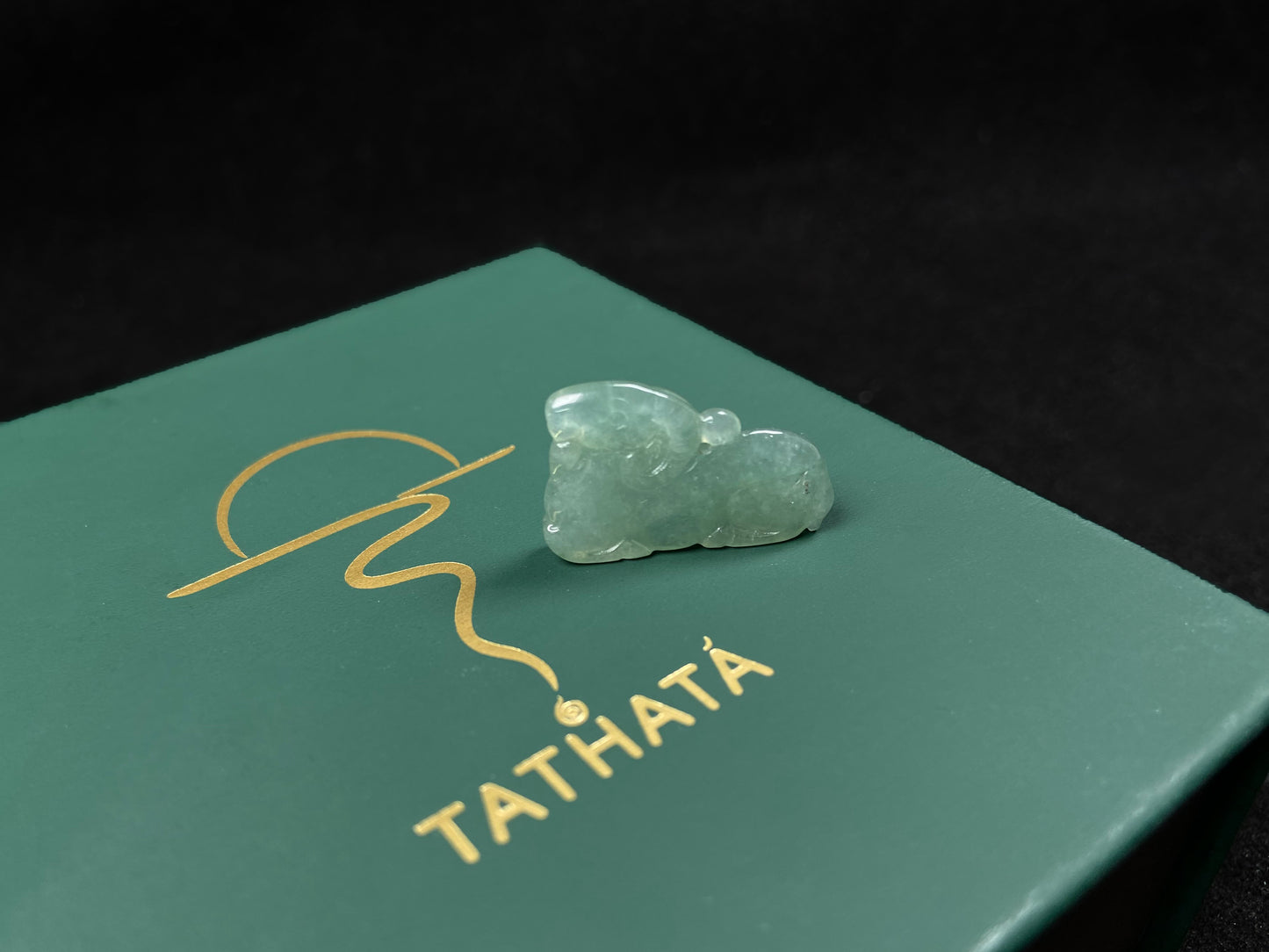 A lustrous pale green sheep loose jadeite.