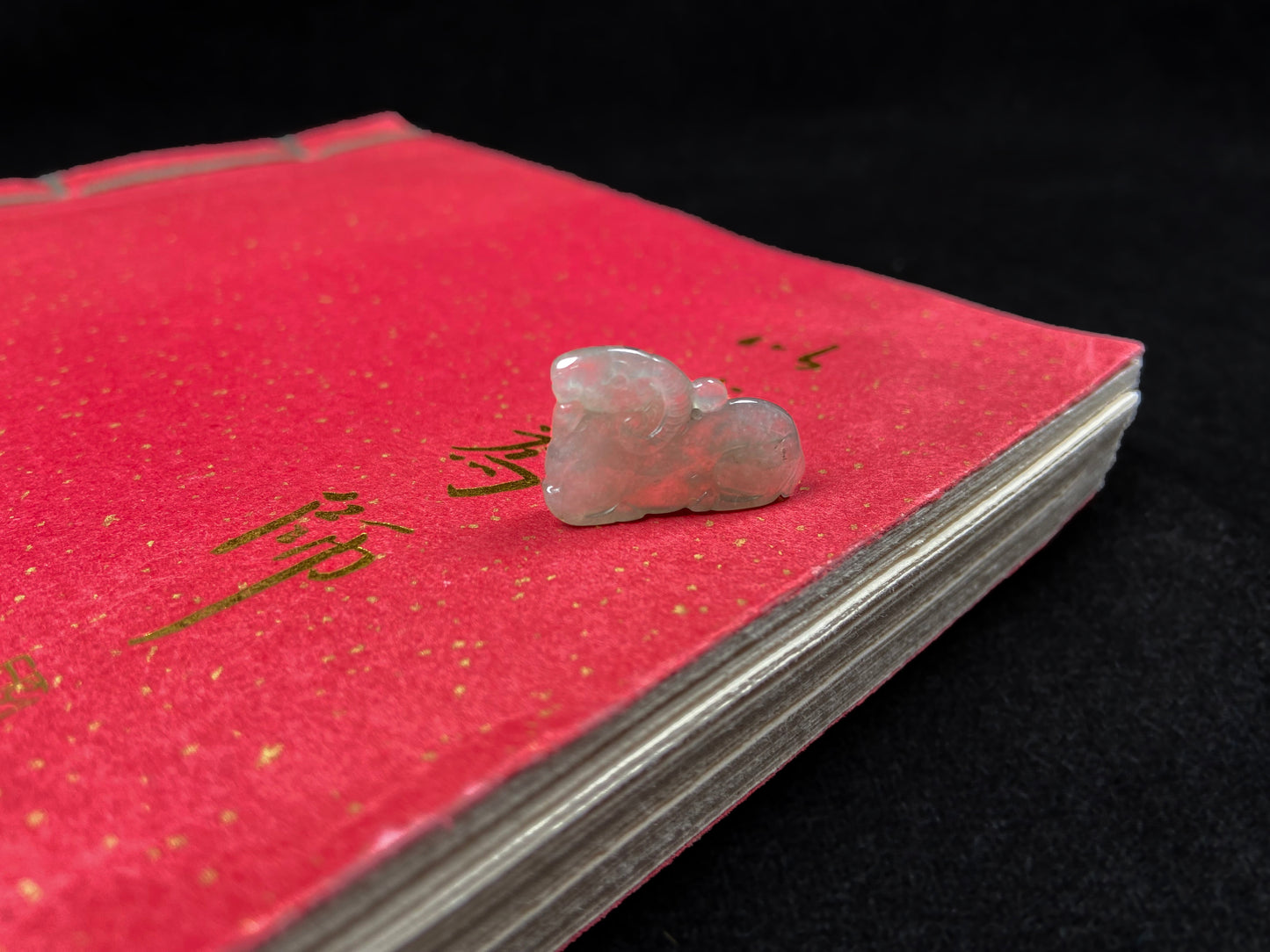 A lustrous pale green sheep loose jadeite.