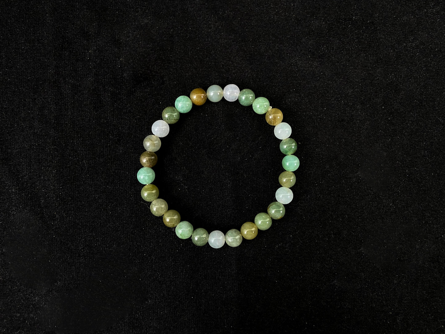 Beaded bracelet with multicolored beads on a black background