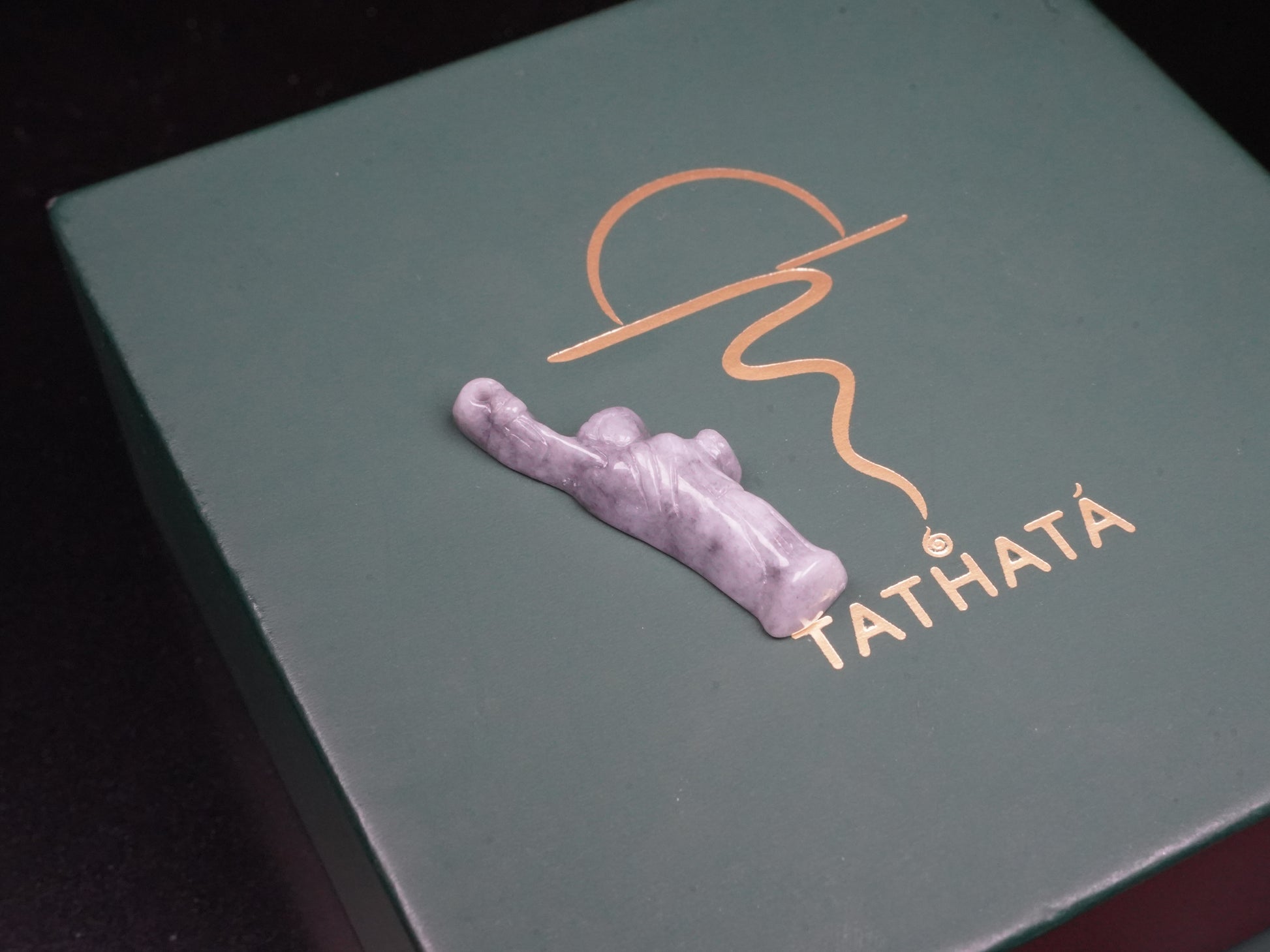 A sleek ssh toned statue of liberty jadeite pendant.