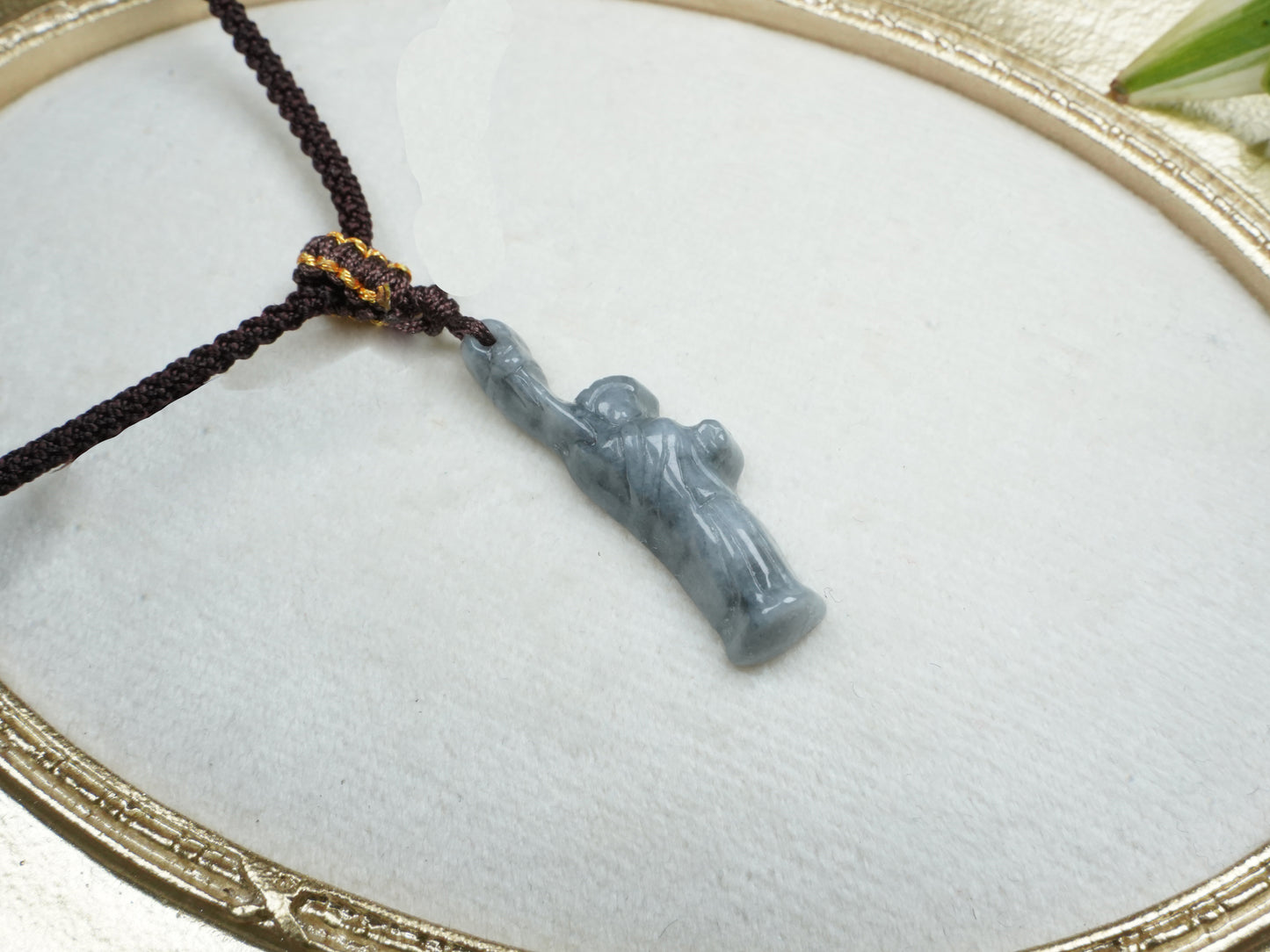 A sleek ssh toned statue of liberty jadeite pendant.