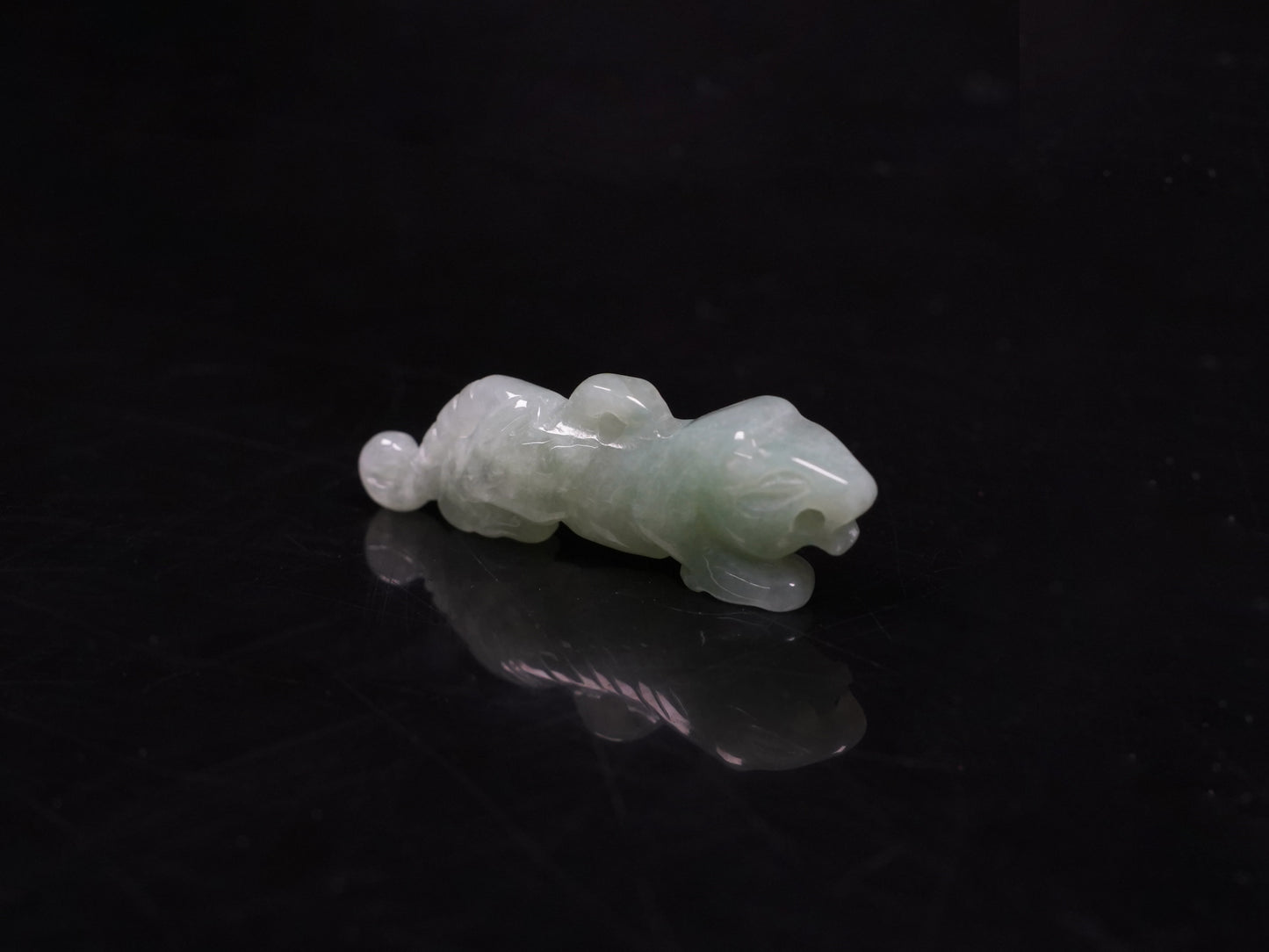 A vivacious misty green tiger loose jadeite.