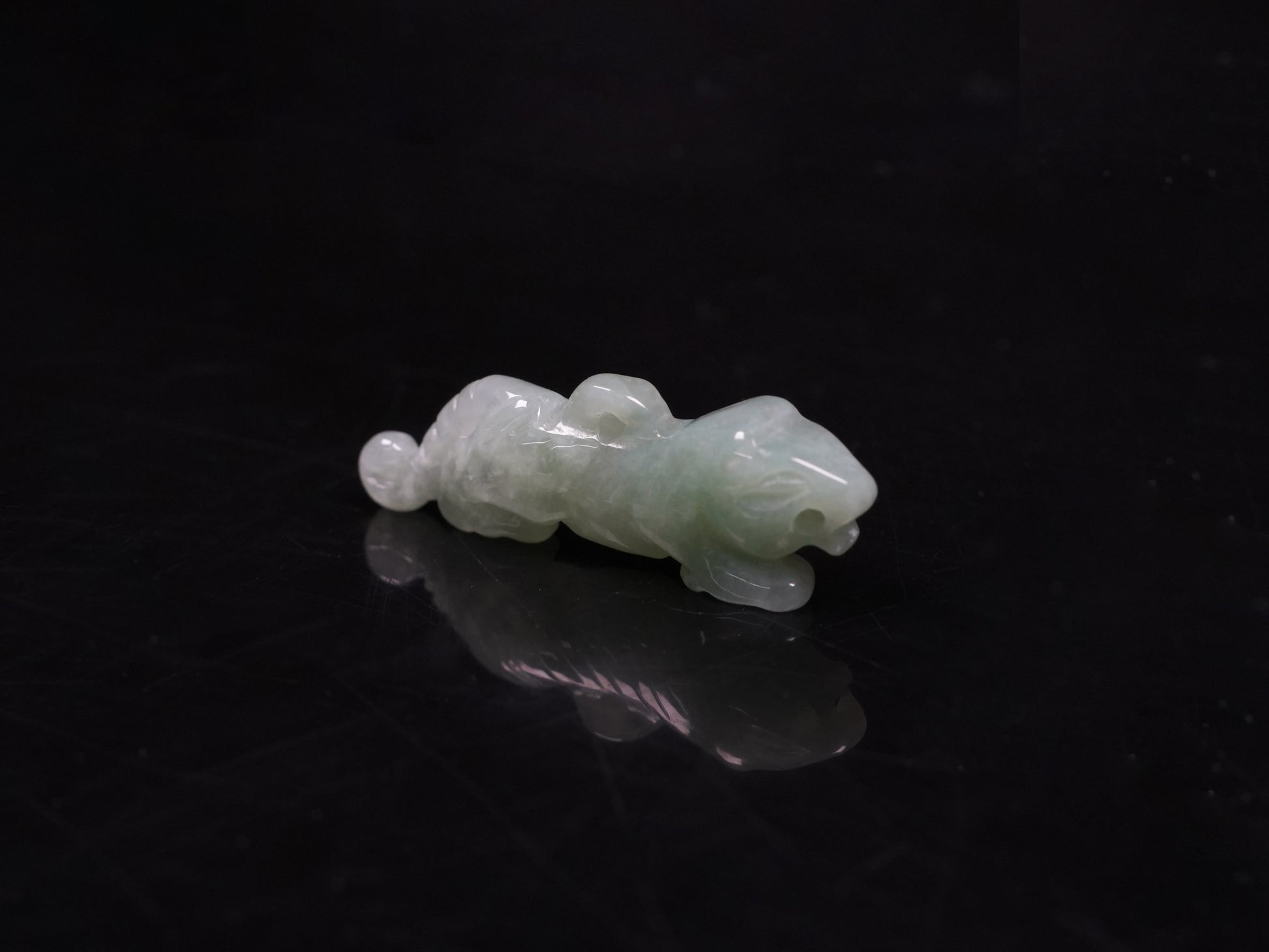 A vivacious misty green tiger loose jadeite.