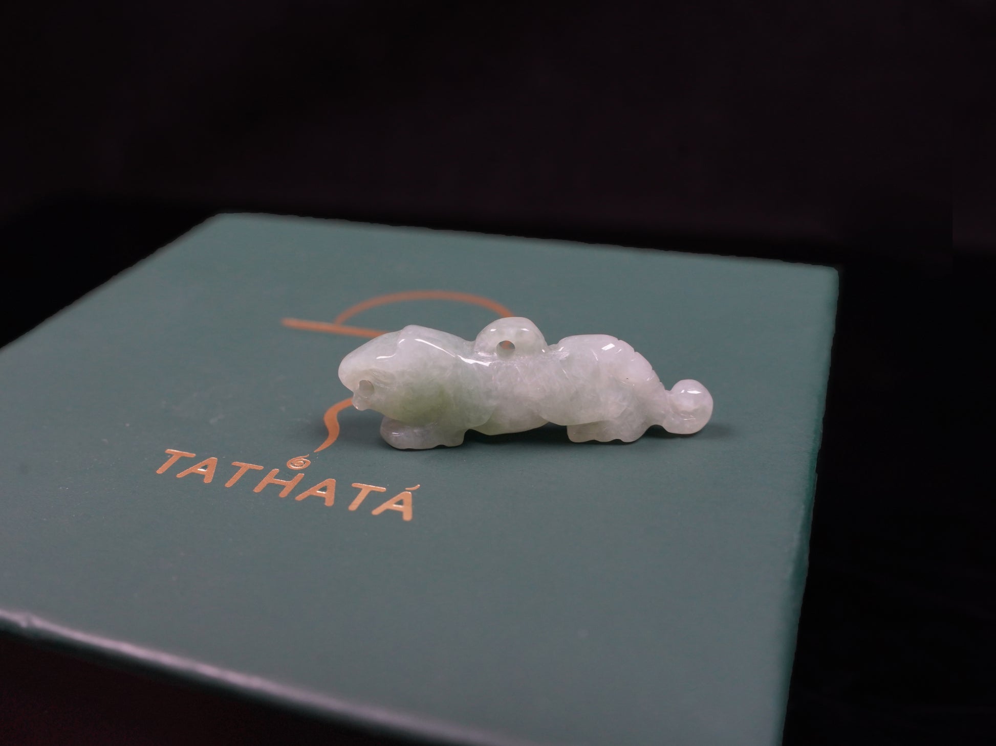 A vivacious misty green tiger loose jadeite.