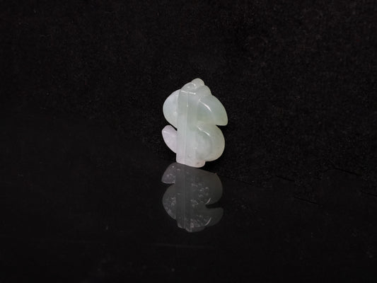 A soft gradient green white dollar symbol loose jadeite.