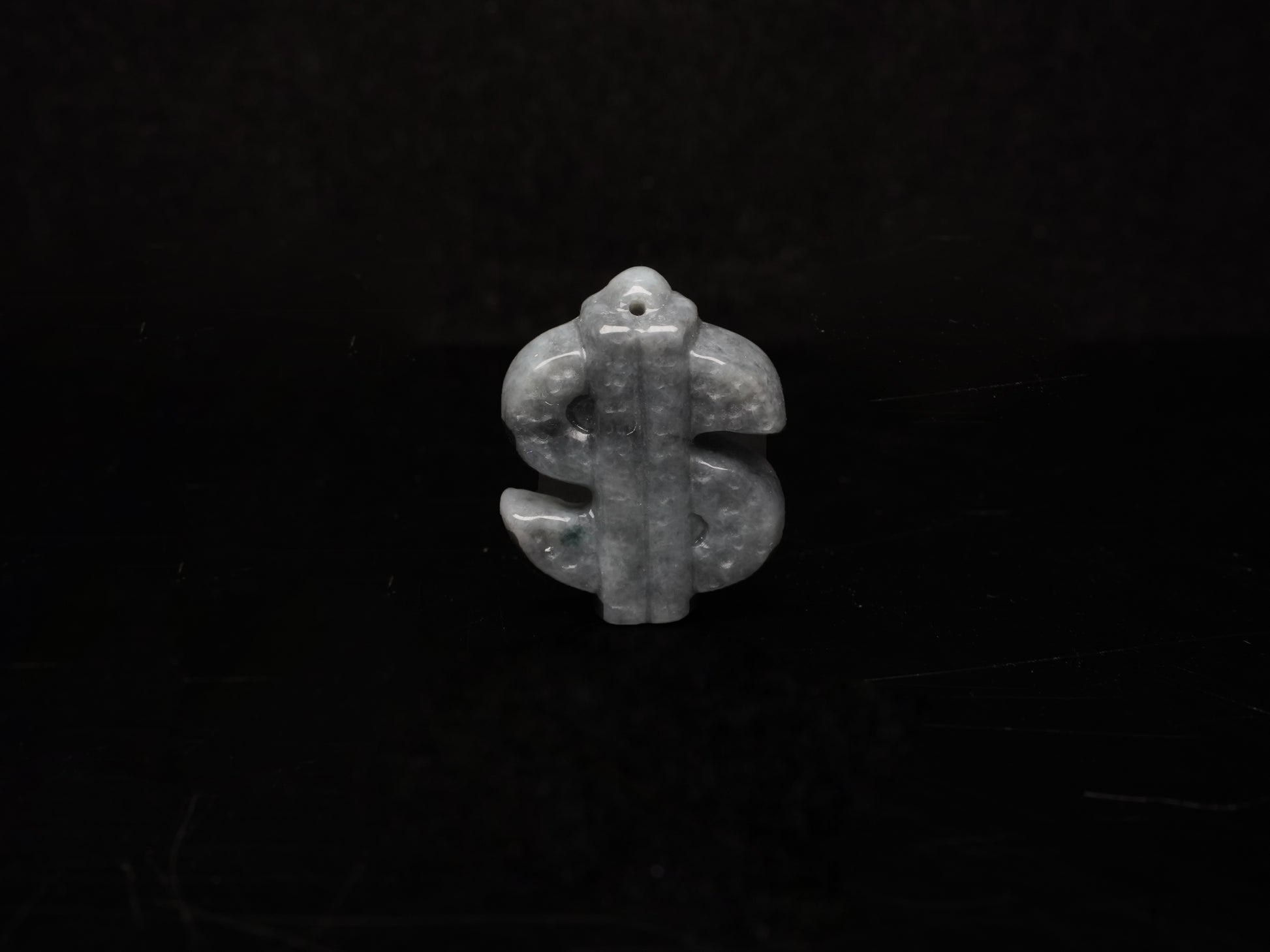 A grey prosperity dollar charm loose jadeite.