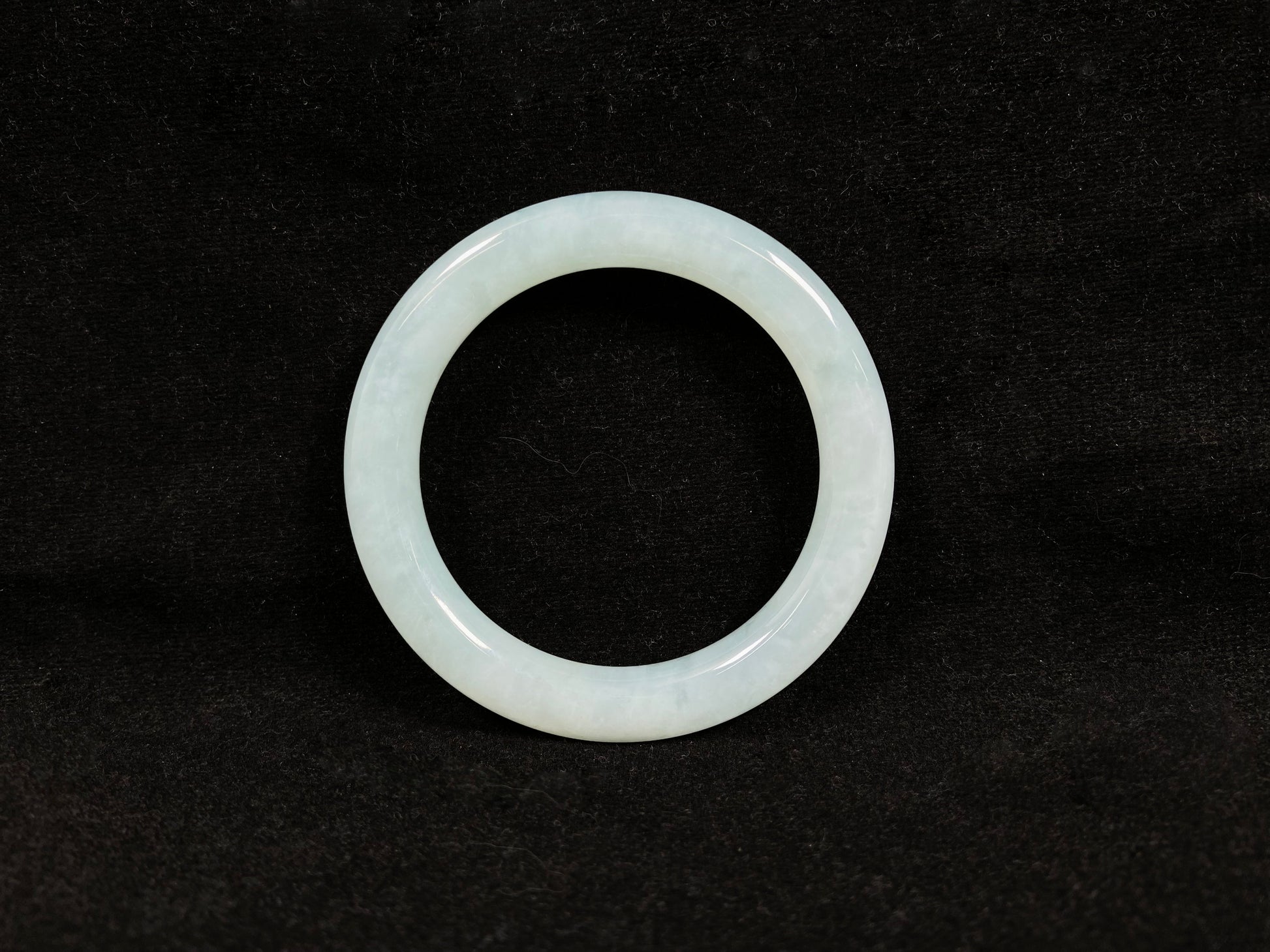 A white ice jadeite bangle.