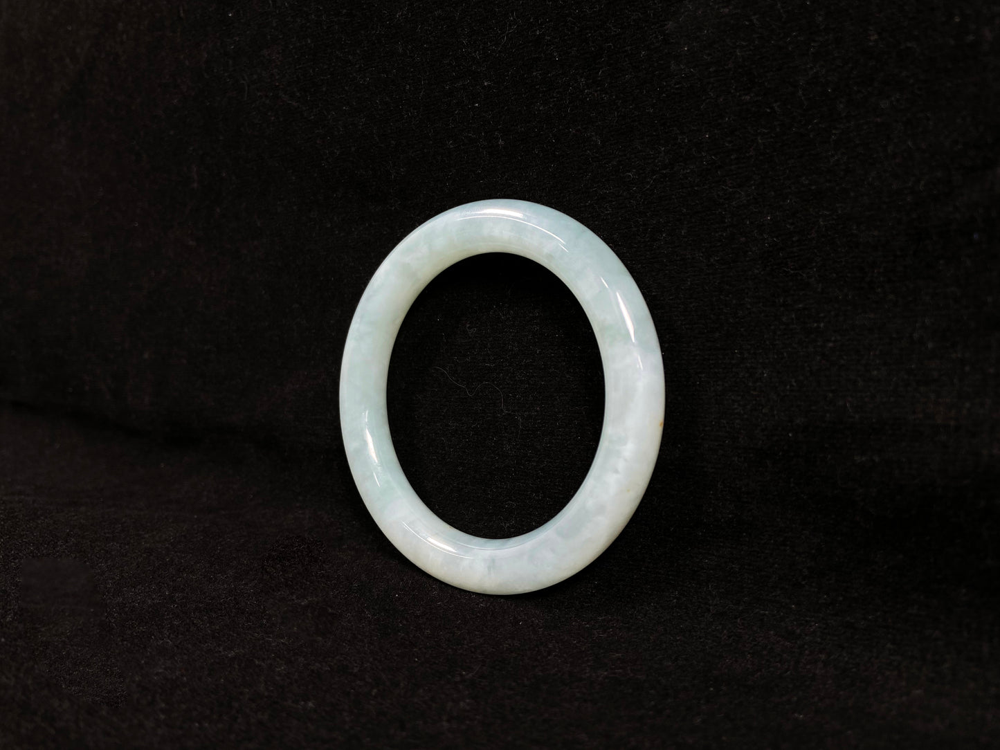A white ice jadeite bangle.