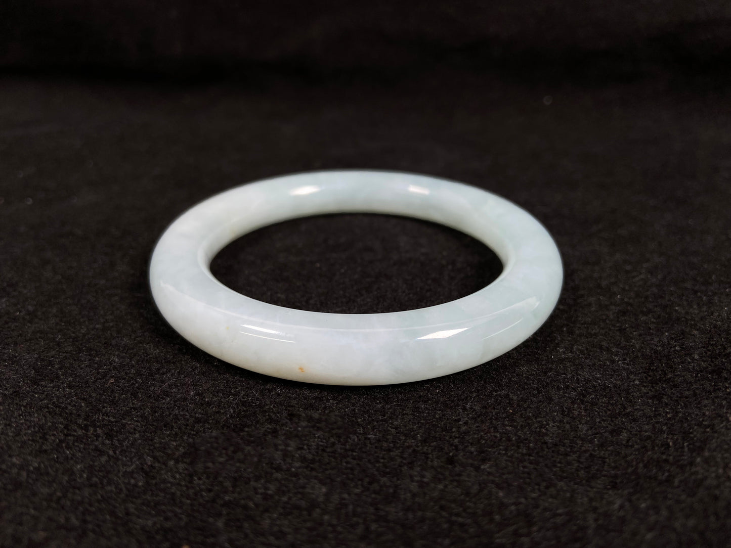 A white ice jadeite bangle.