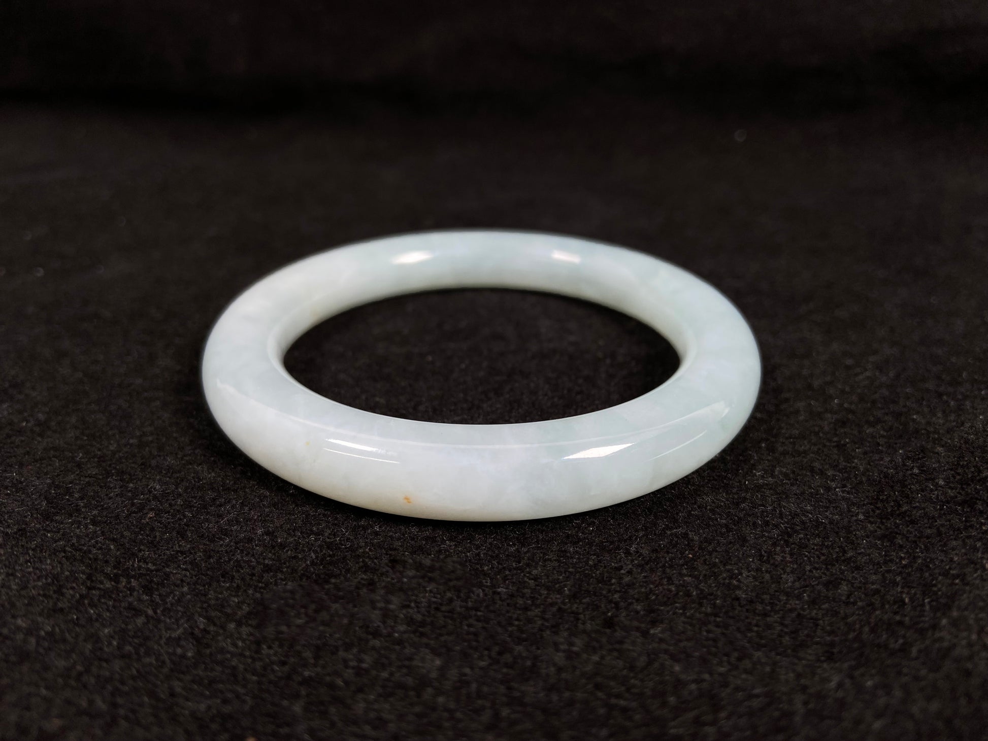 A white ice jadeite bangle.