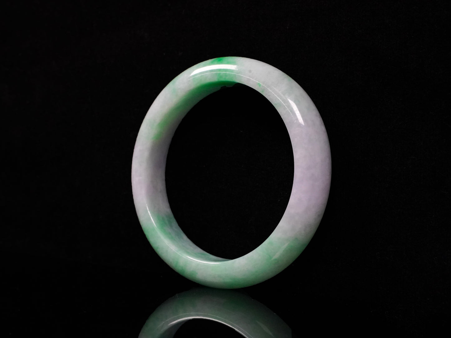 A lilac and viridescent bi-color gradient  jadeite bangle.