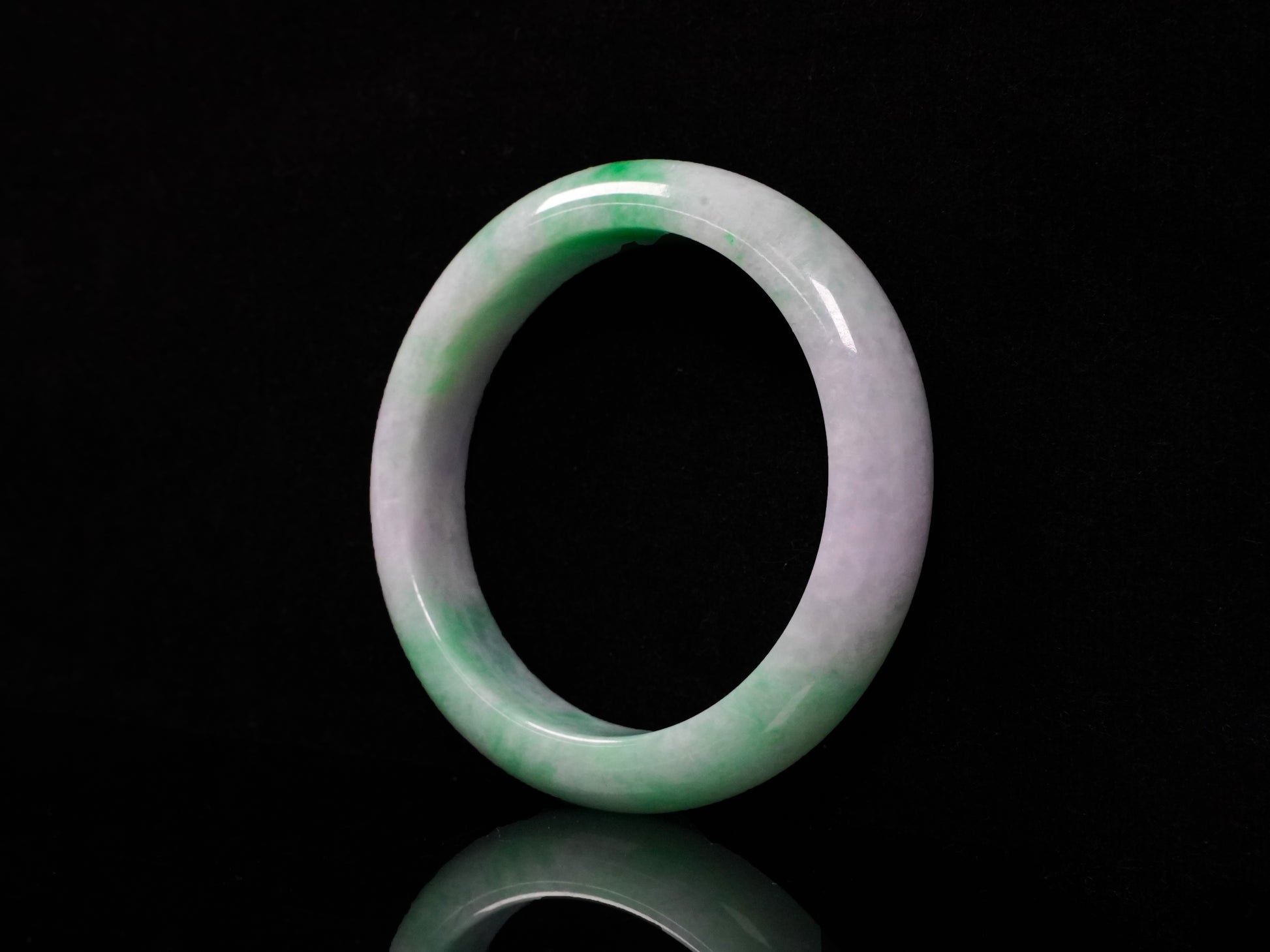 A lilac and viridescent bi-color gradient  jadeite bangle.