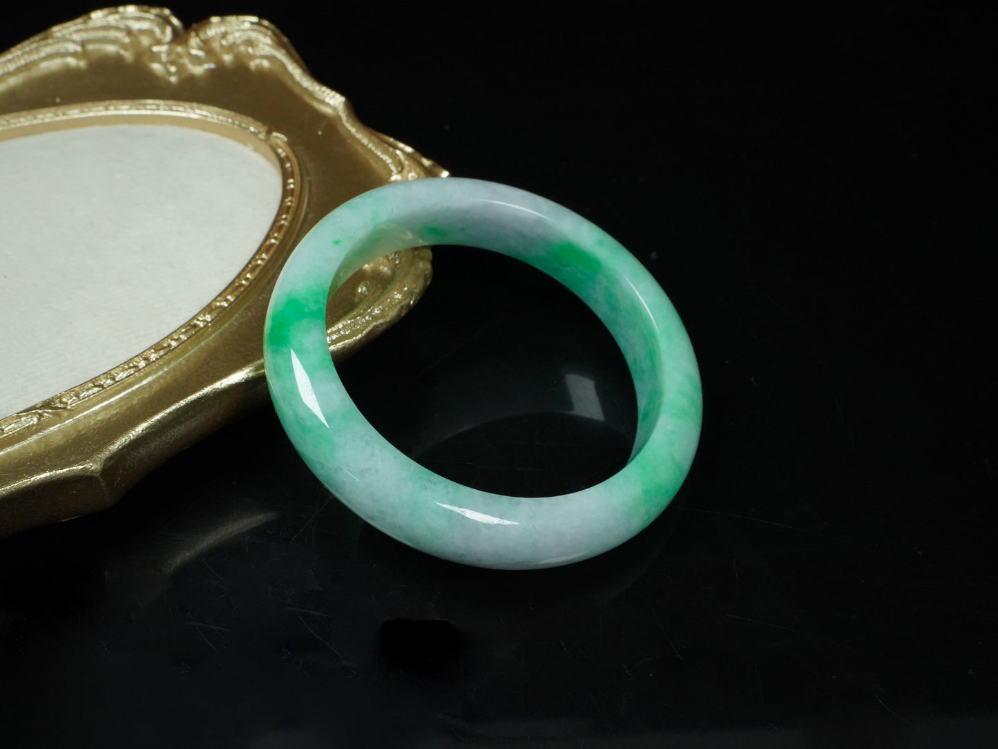 A lilac and viridescent bi-color gradient  jadeite bangle.