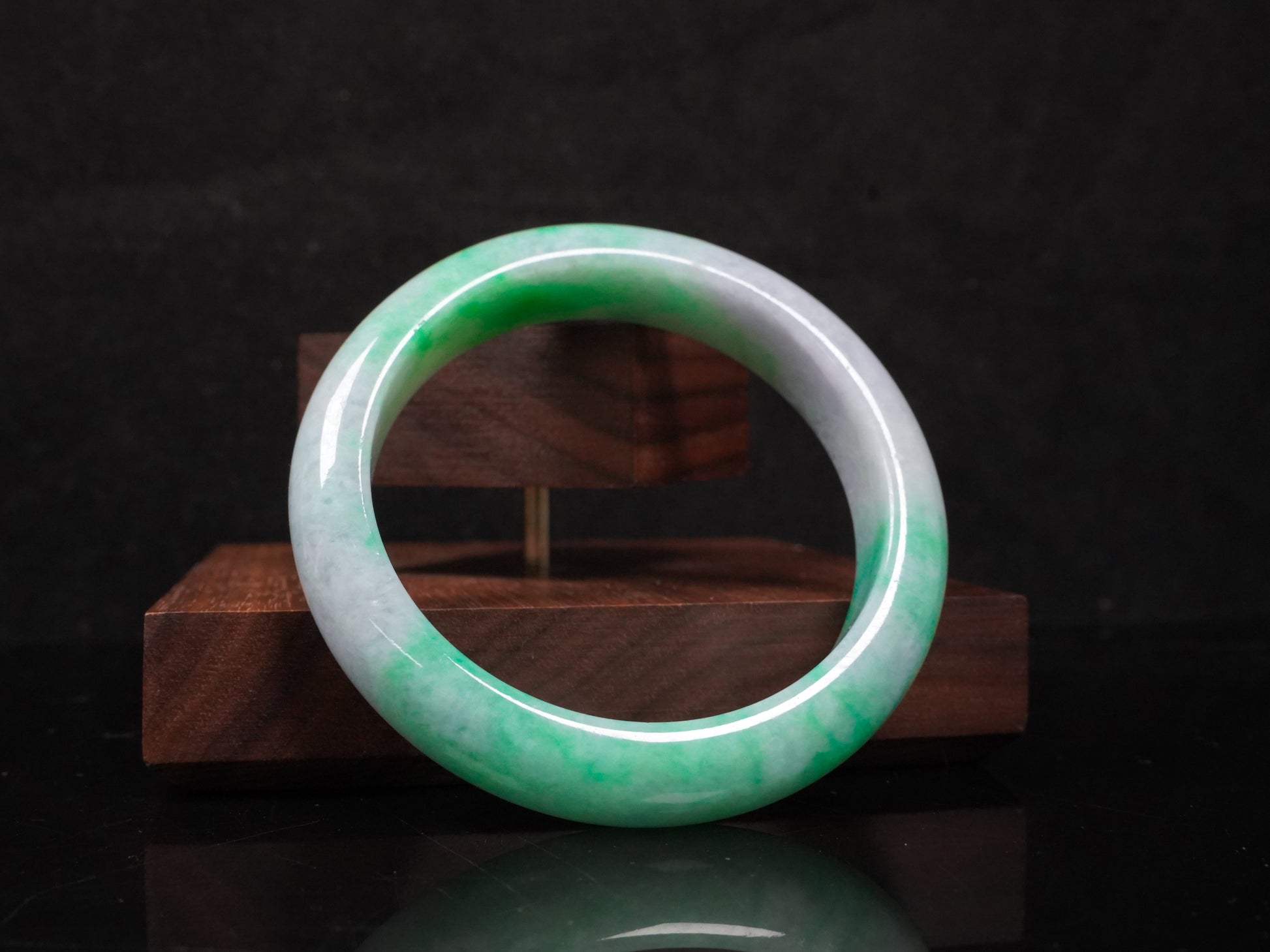 A lilac and viridescent bi-color gradient  jadeite bangle.