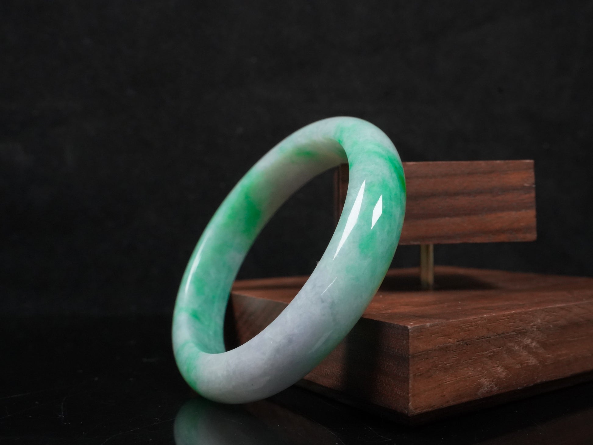 A lilac and viridescent bi-color gradient  jadeite bangle.
