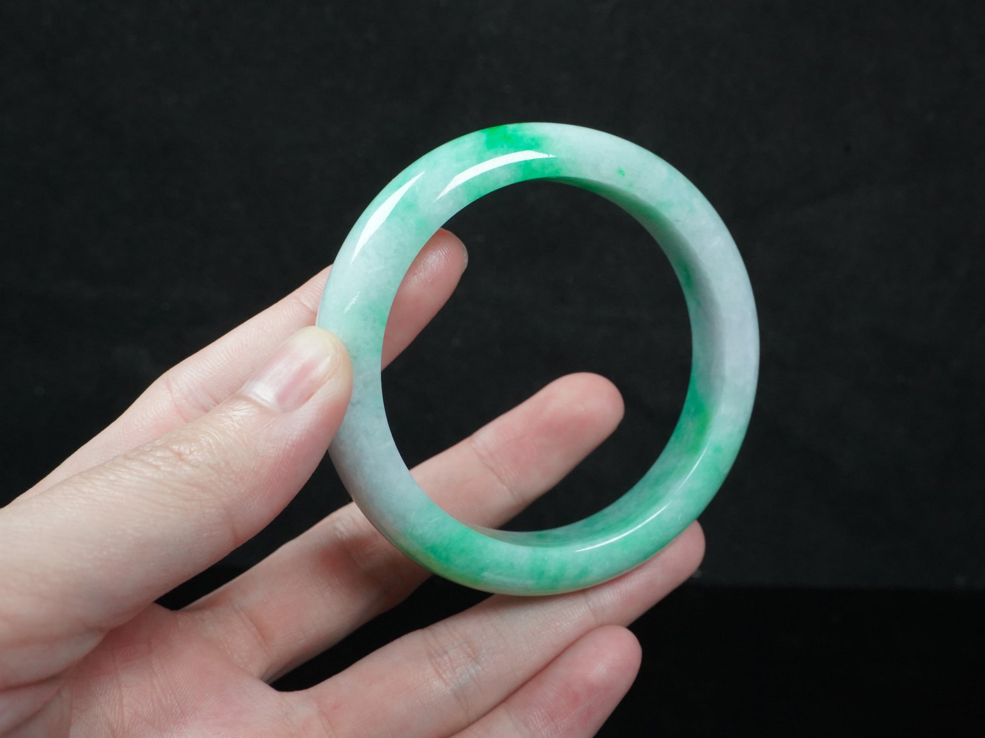 A lilac and viridescent bi-color gradient  jadeite bangle.
