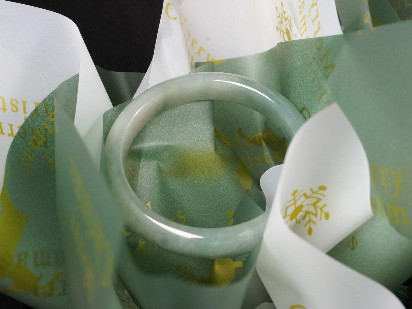 A mist green gentle luster jadeite bangle.