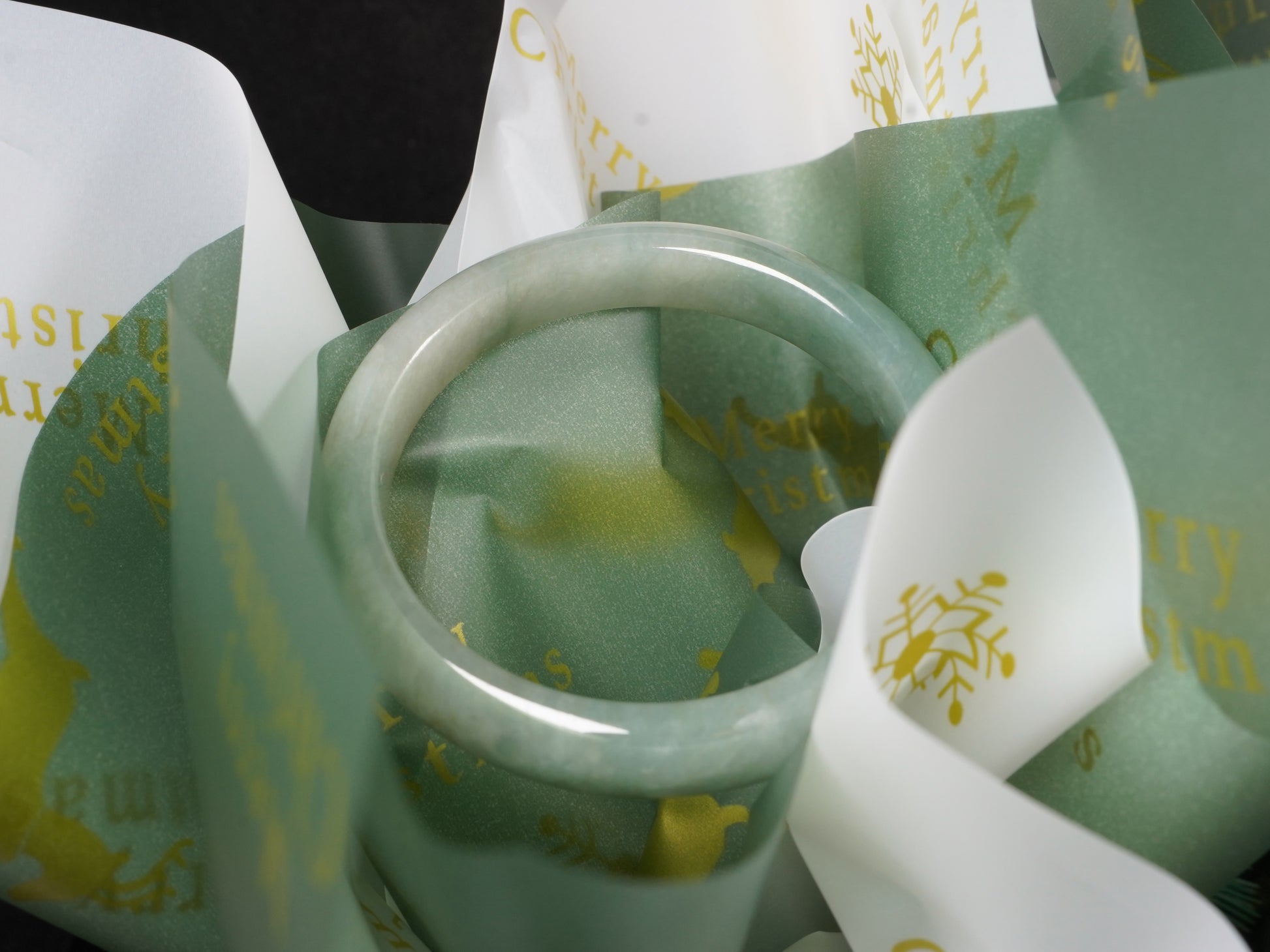 A mist green gentle luster jadeite bangle.