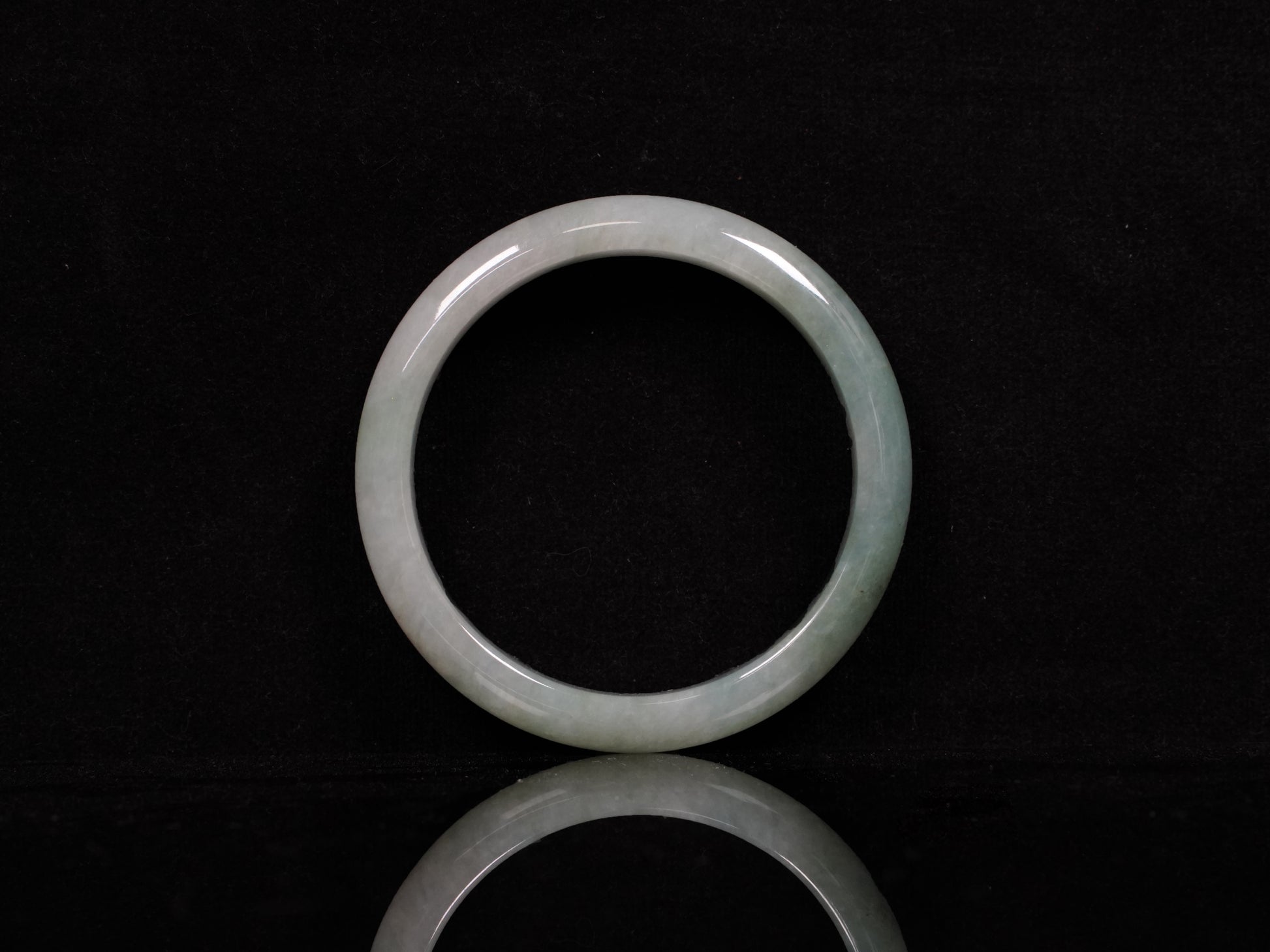 A mist green gentle luster jadeite bangle.