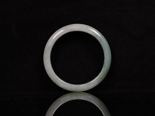 A mist green gentle luster jadeite bangle.
